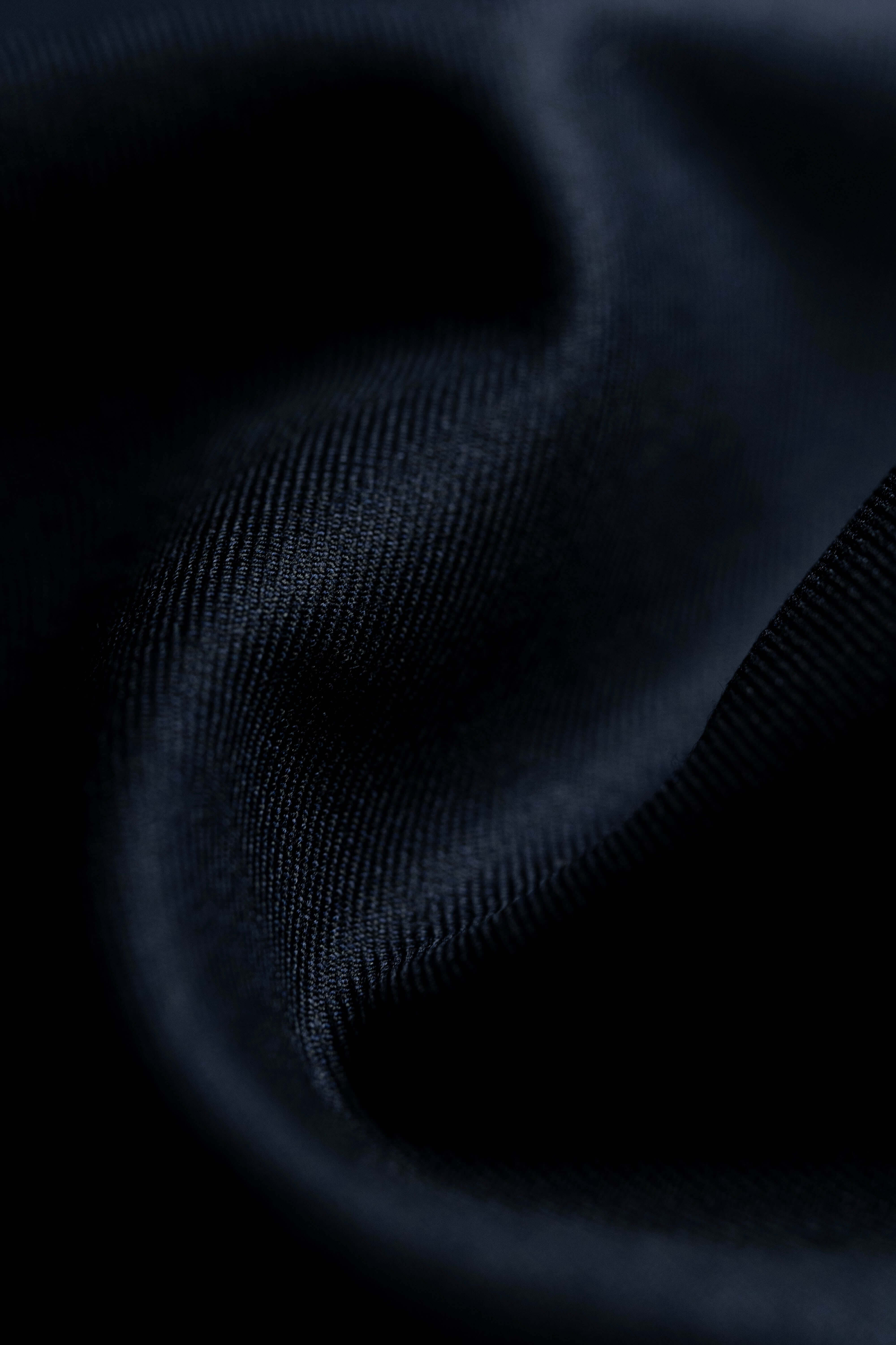 Close-up of Fintex of London Midnight Navy wool suit fabric texture.