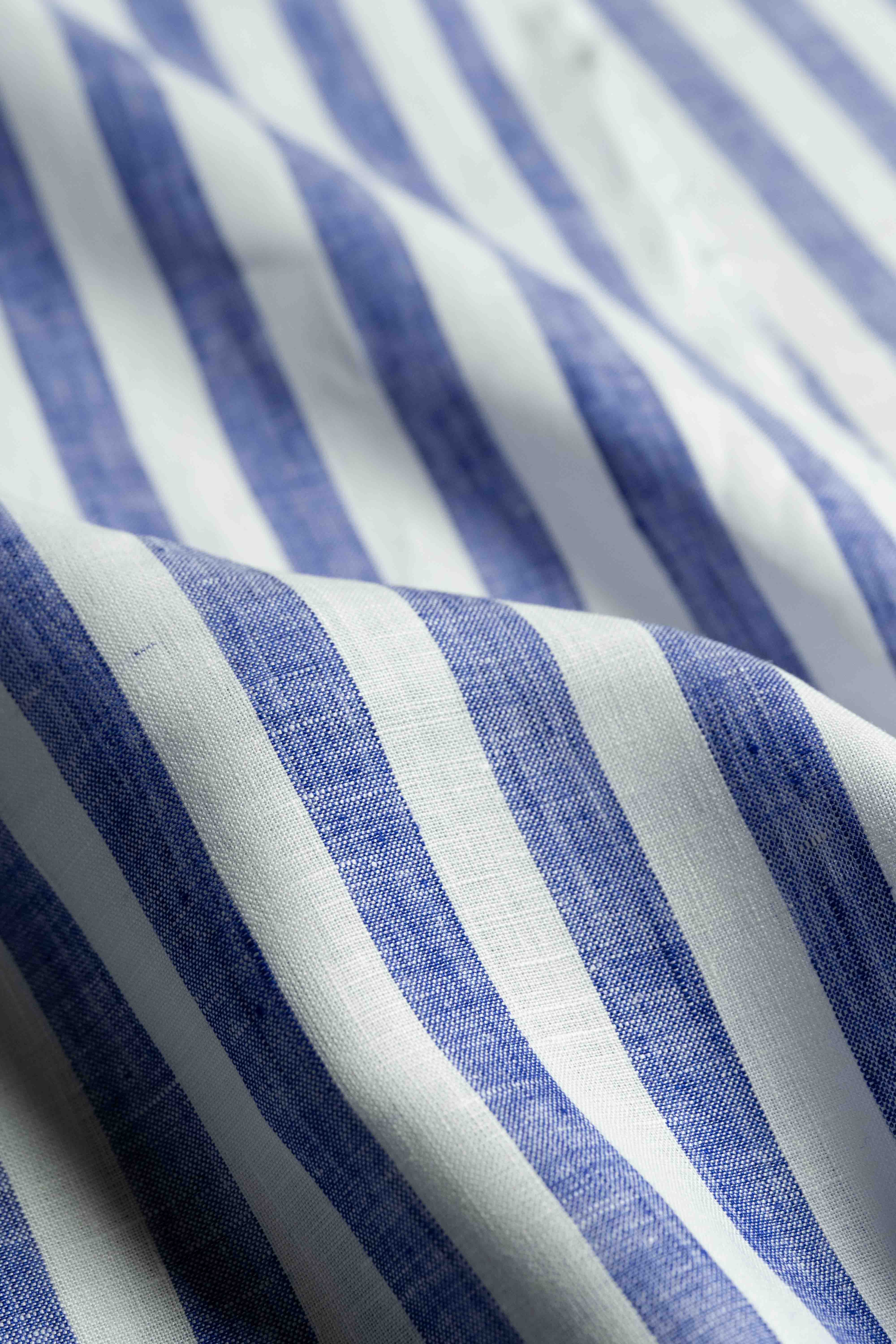 Solbiati linen navy stripe shirt fabric showing detailed texture and pattern in blue and white stripes.