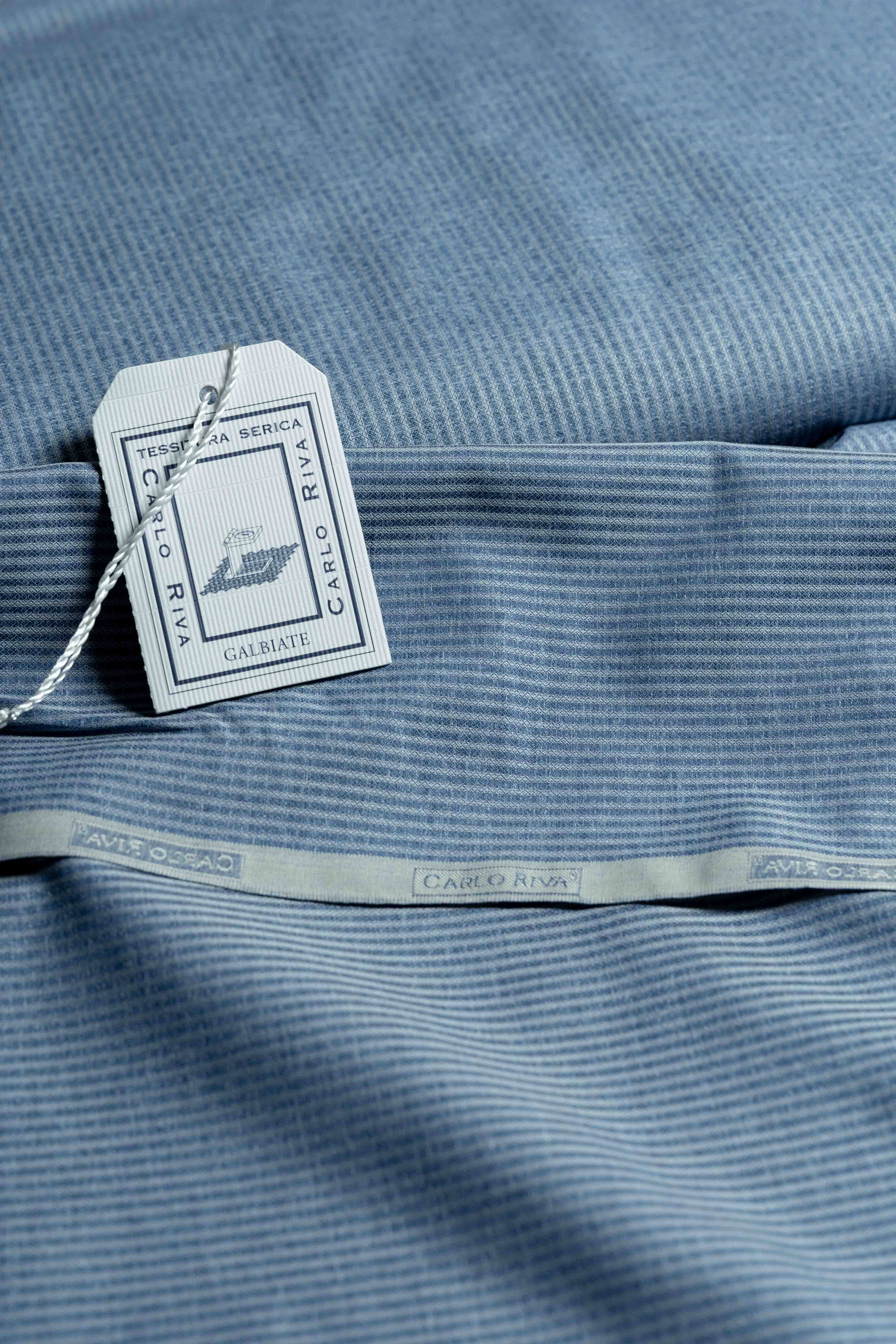 Carlo Riva blue stripe shirt fabric with label and tag, width 90cm, showcasing quality material and elegant design.