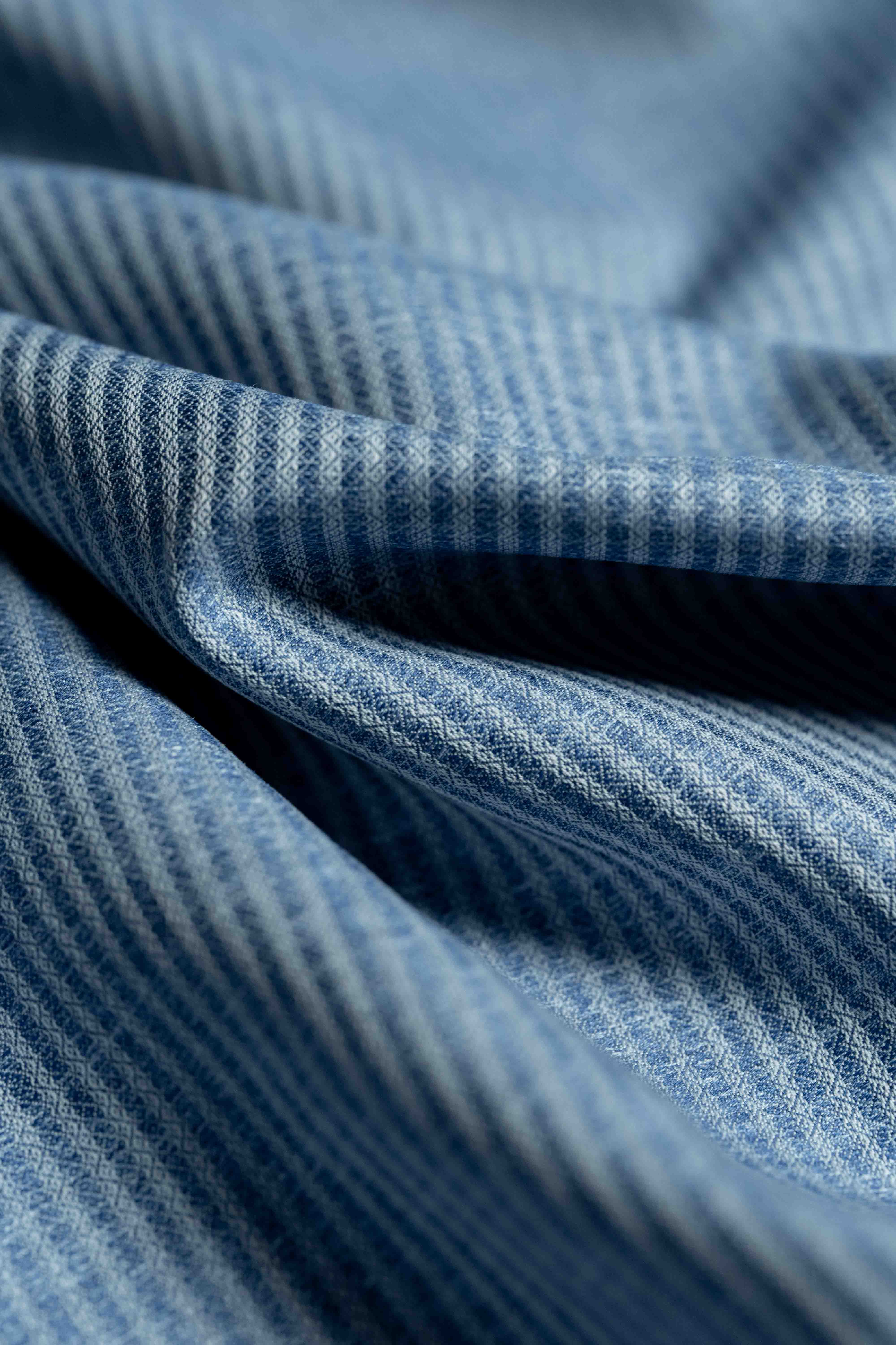 Carlo Riva Blue Stripe Shirt Fabric close-up showing fine blue and white stripes on a soft textile surface.