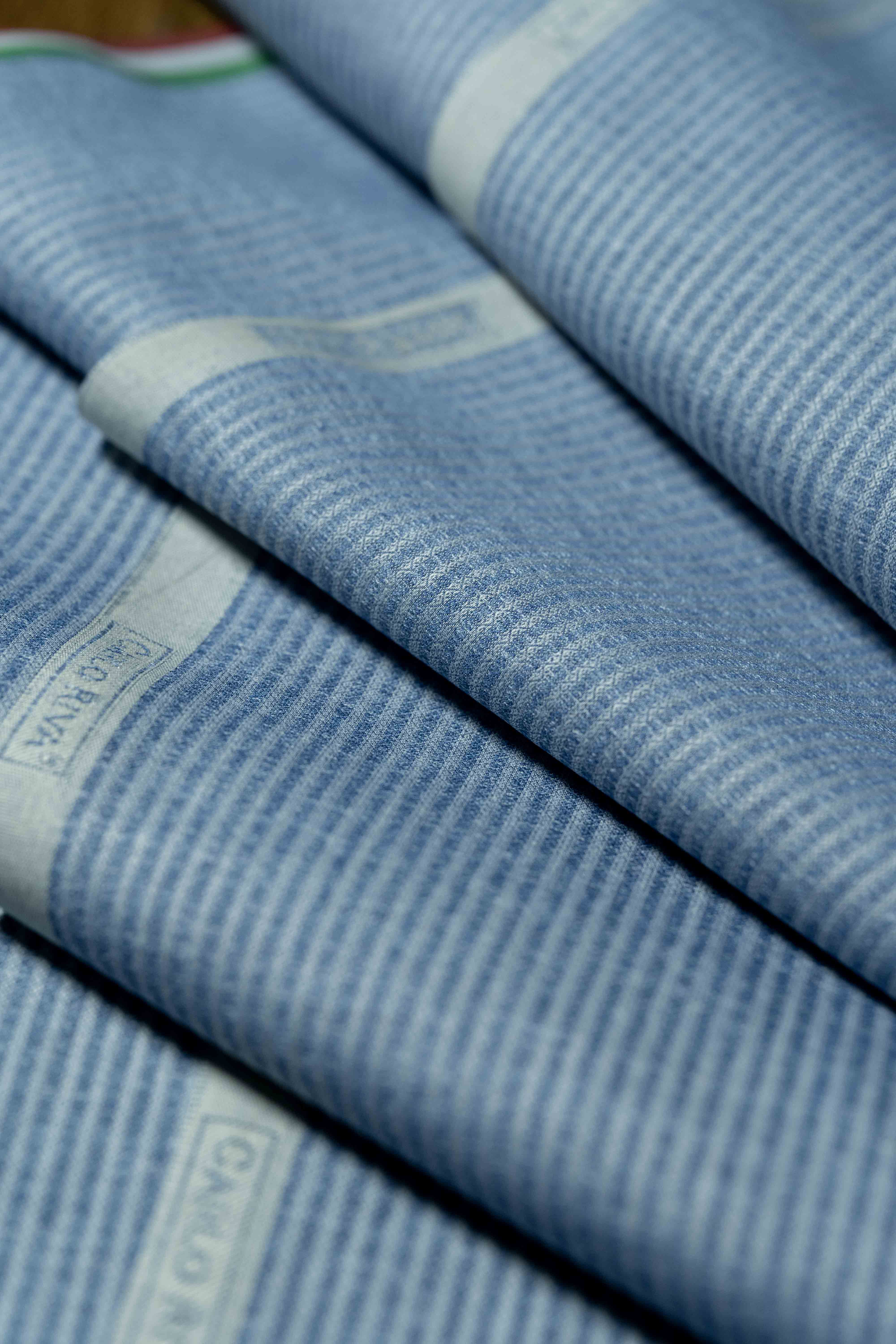 Carlo Riva Blue Stripe Shirt Fabric close-up showing folded texture and design elements.