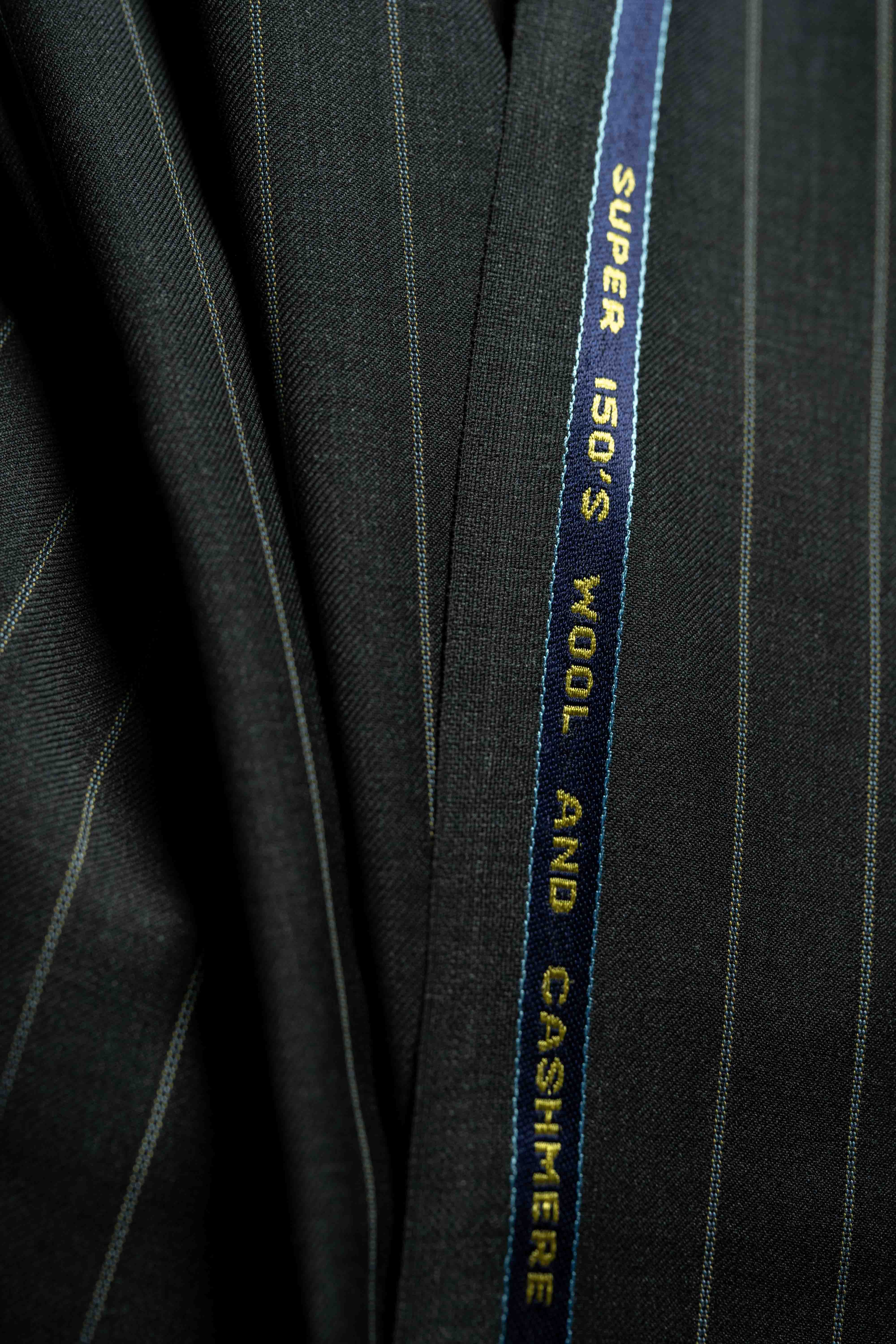Close-up of Charcoal Stripe 150's & Cashmere Suiting fabric showcasing the quality of Cashmere.