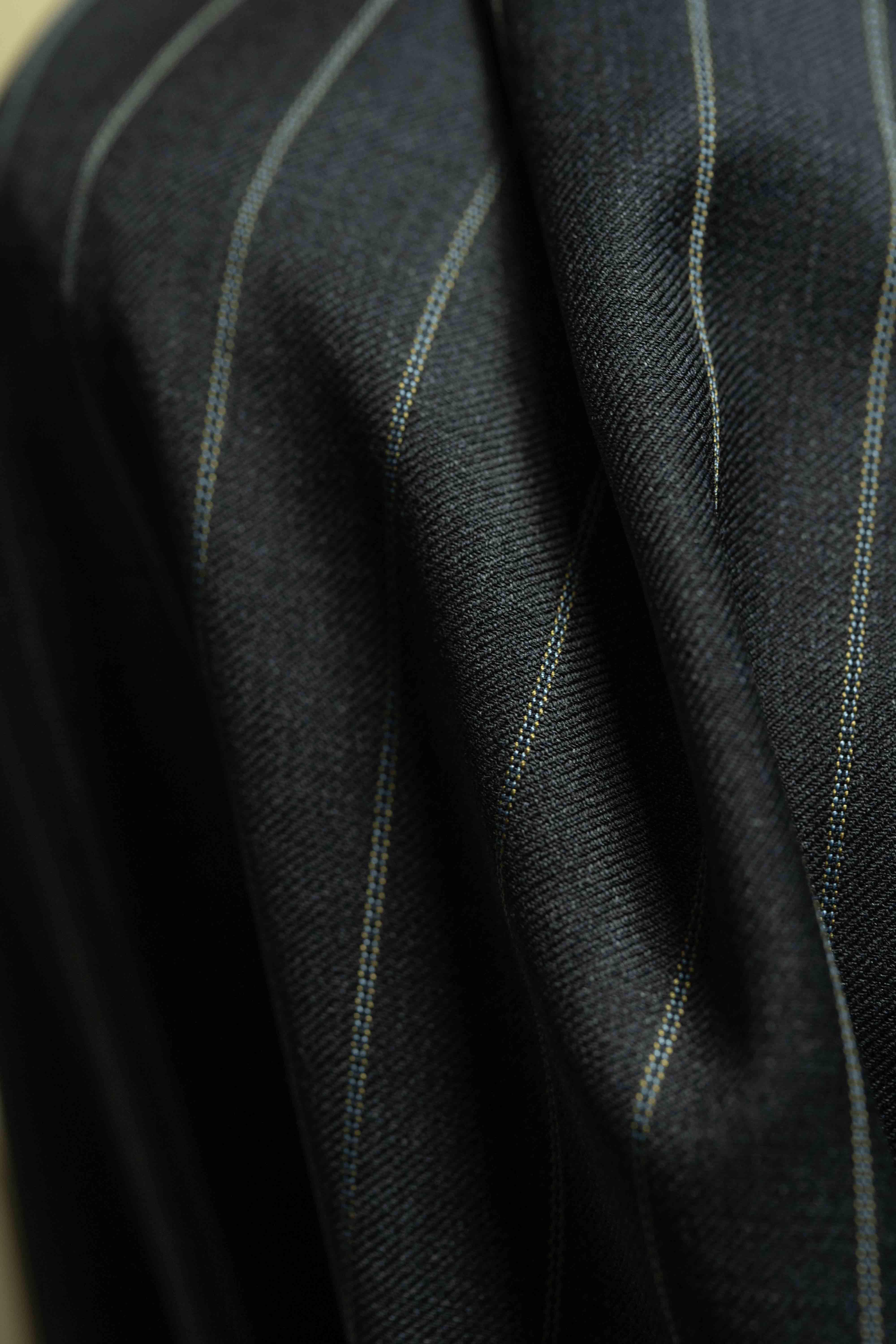 Close-up of Charcoal Stripe fabric featuring 150's & Cashmere, ideal for suiting.