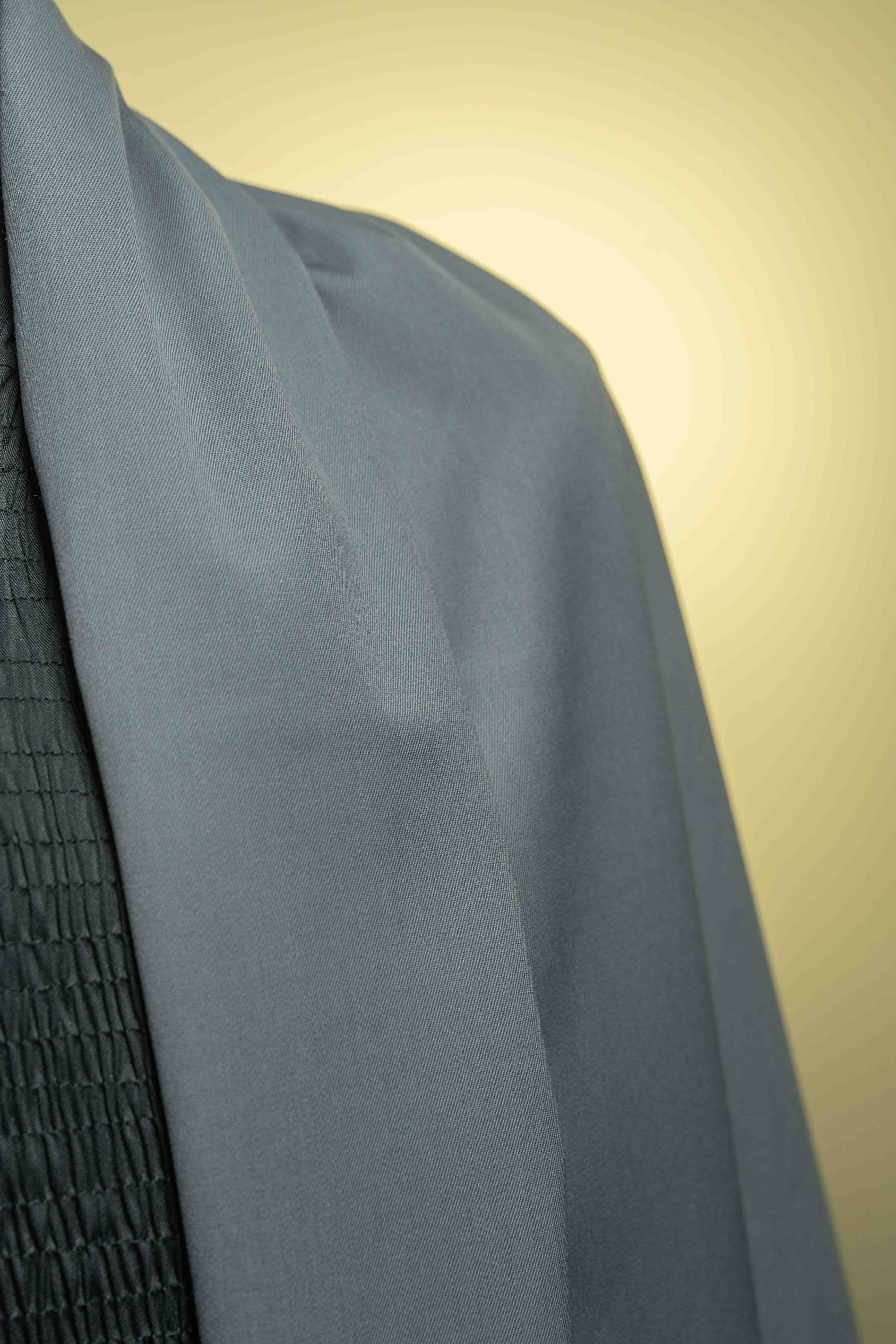 Close-up of Grey 120's Wool Gabardine Suit Fabric, perfect for tailored garments, showcasing soft texture and quality craftsmanship.