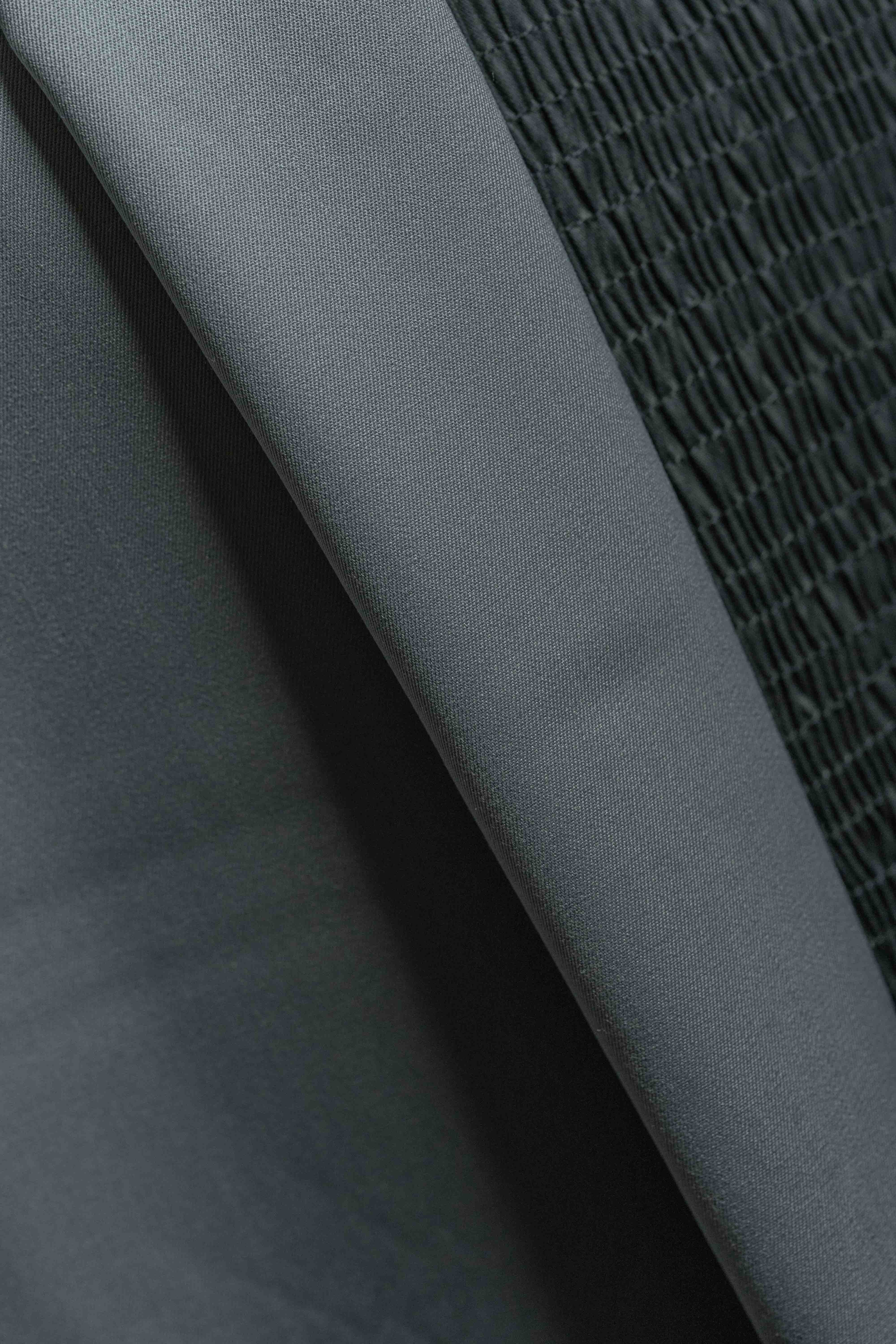 Grey 120's wool gabardine suit fabric (V23521) showcasing a smooth texture, ideal for tailored suits.