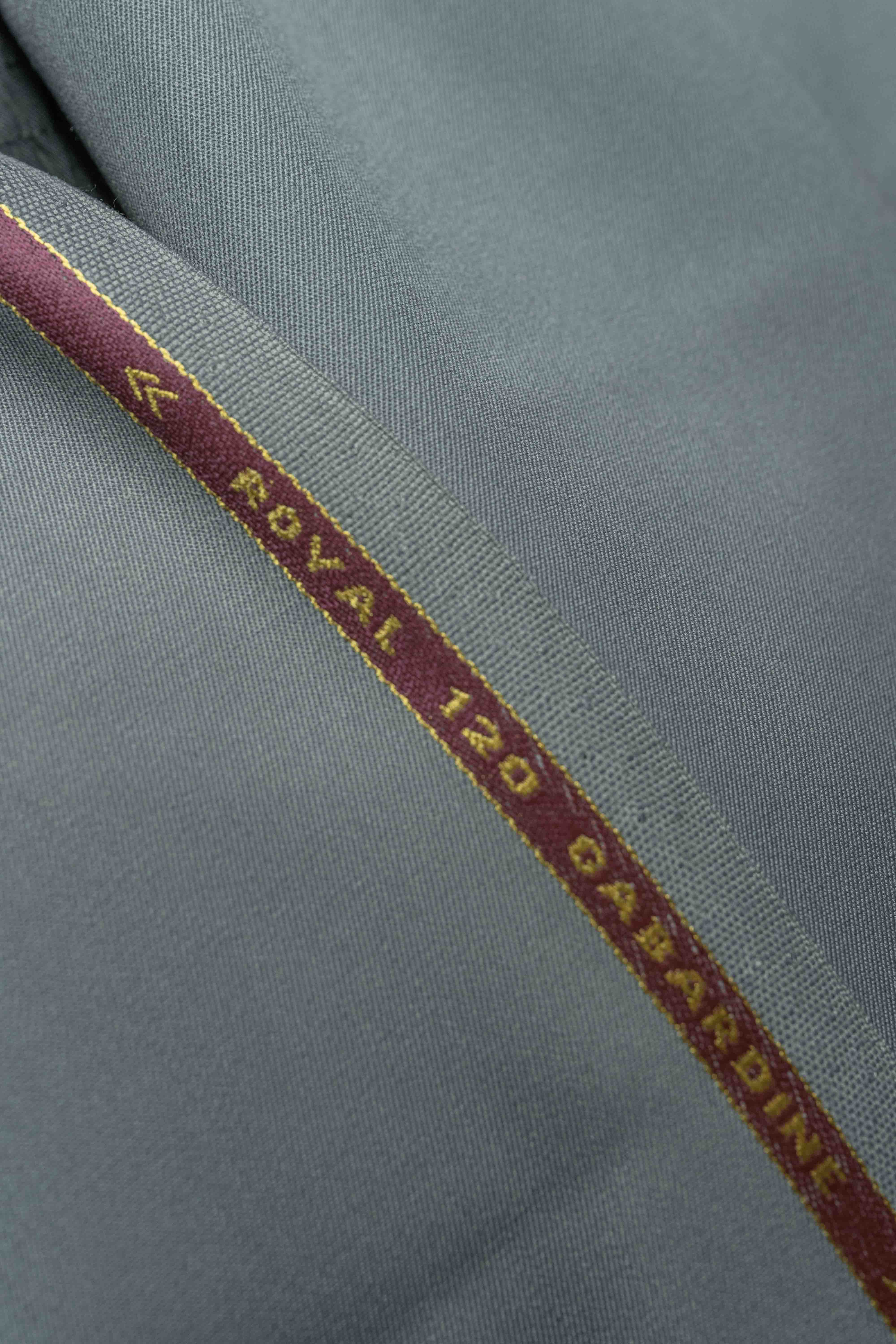Grey 120's wool gabardine suit fabric (V23521) showcasing the texture and quality of premium suit fabric.