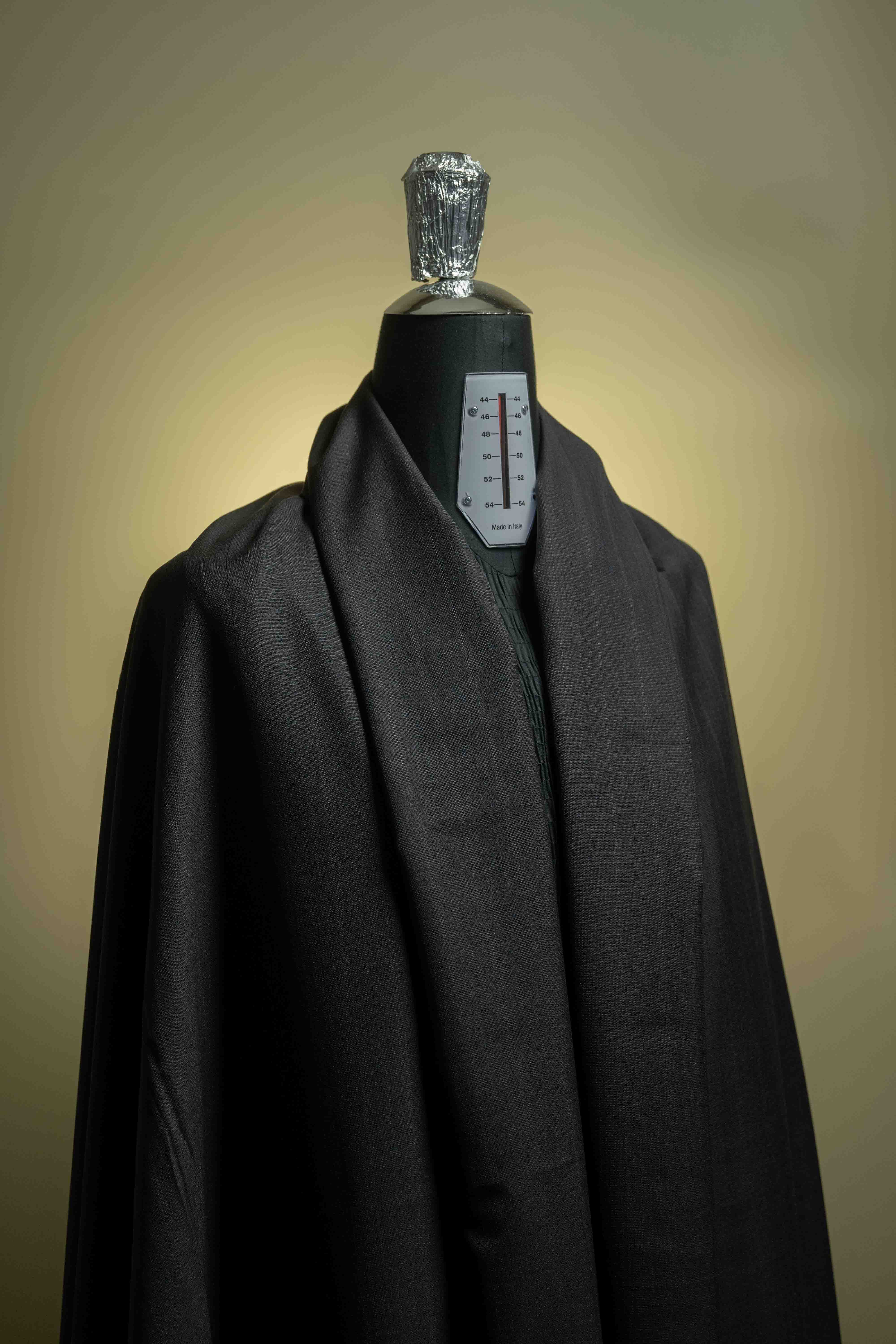 Holland & Sherry Fabric displayed on a mannequin showcasing a charcoal stripe in 130's suiting.