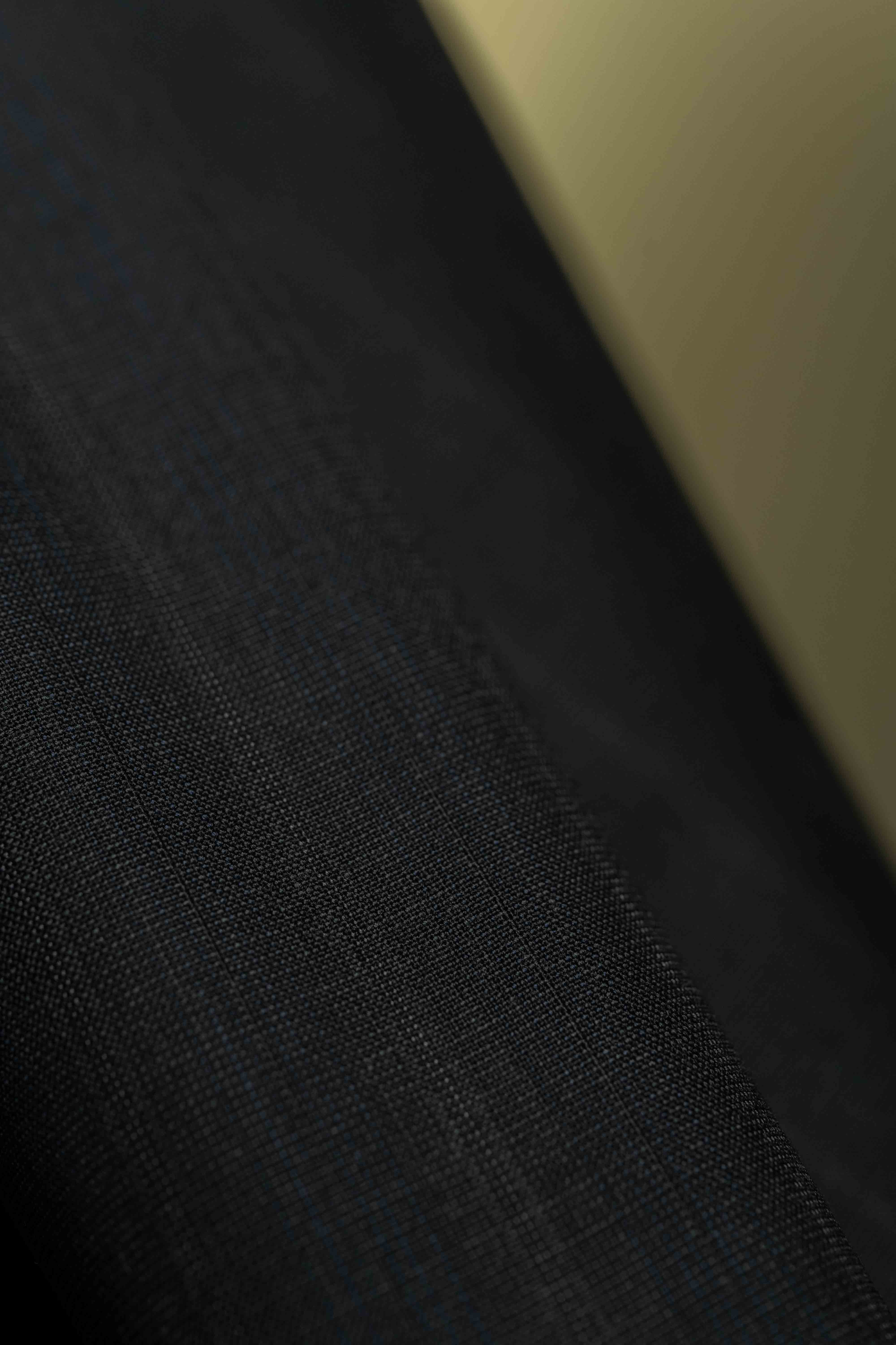 Holland & Sherry Fabric Charcoal Stripe 130's Suiting close-up showing texture and quality.