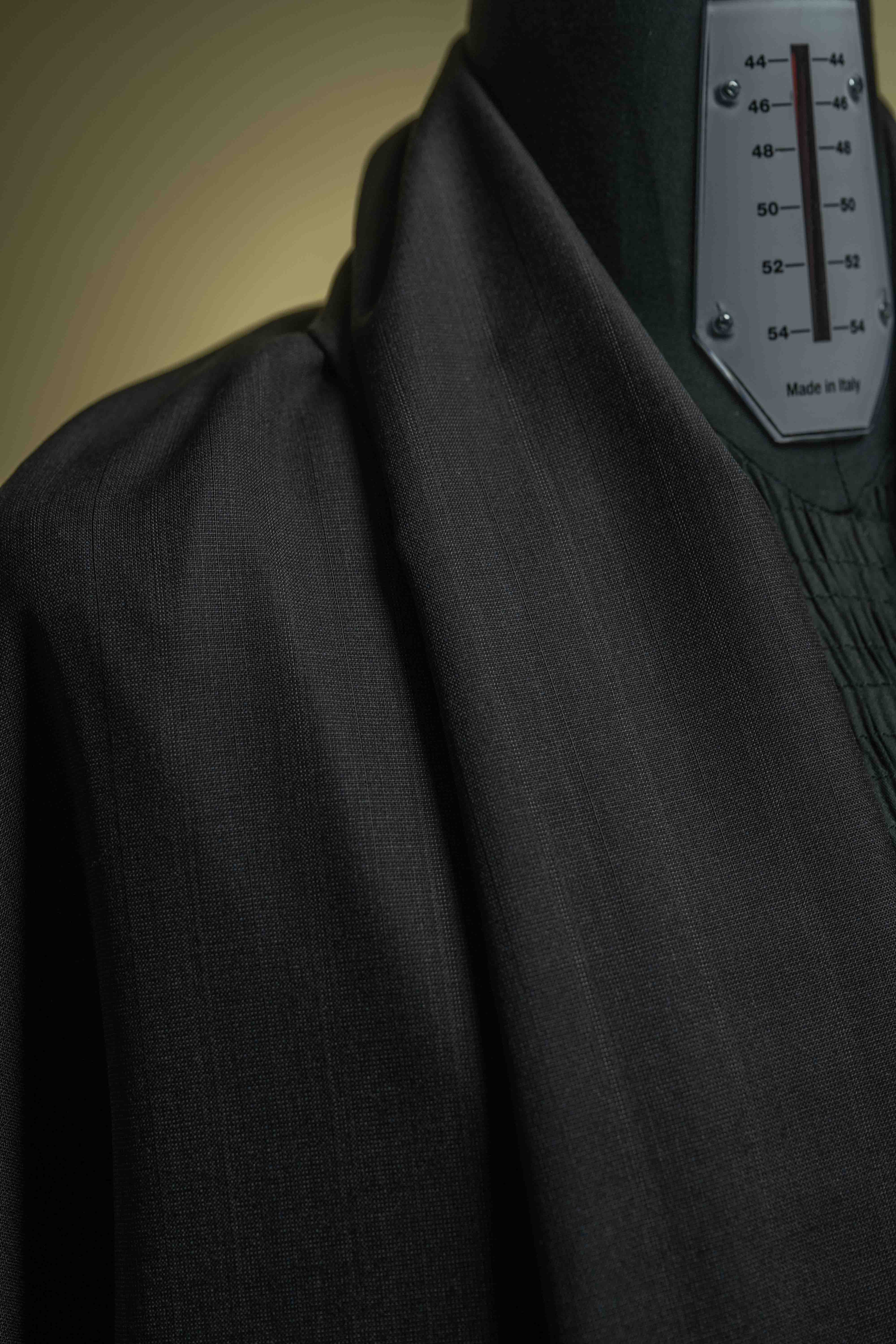 Holland & Sherry Fabric Charcoal Stripe 130's Suiting showing texture and quality craftsmanship.