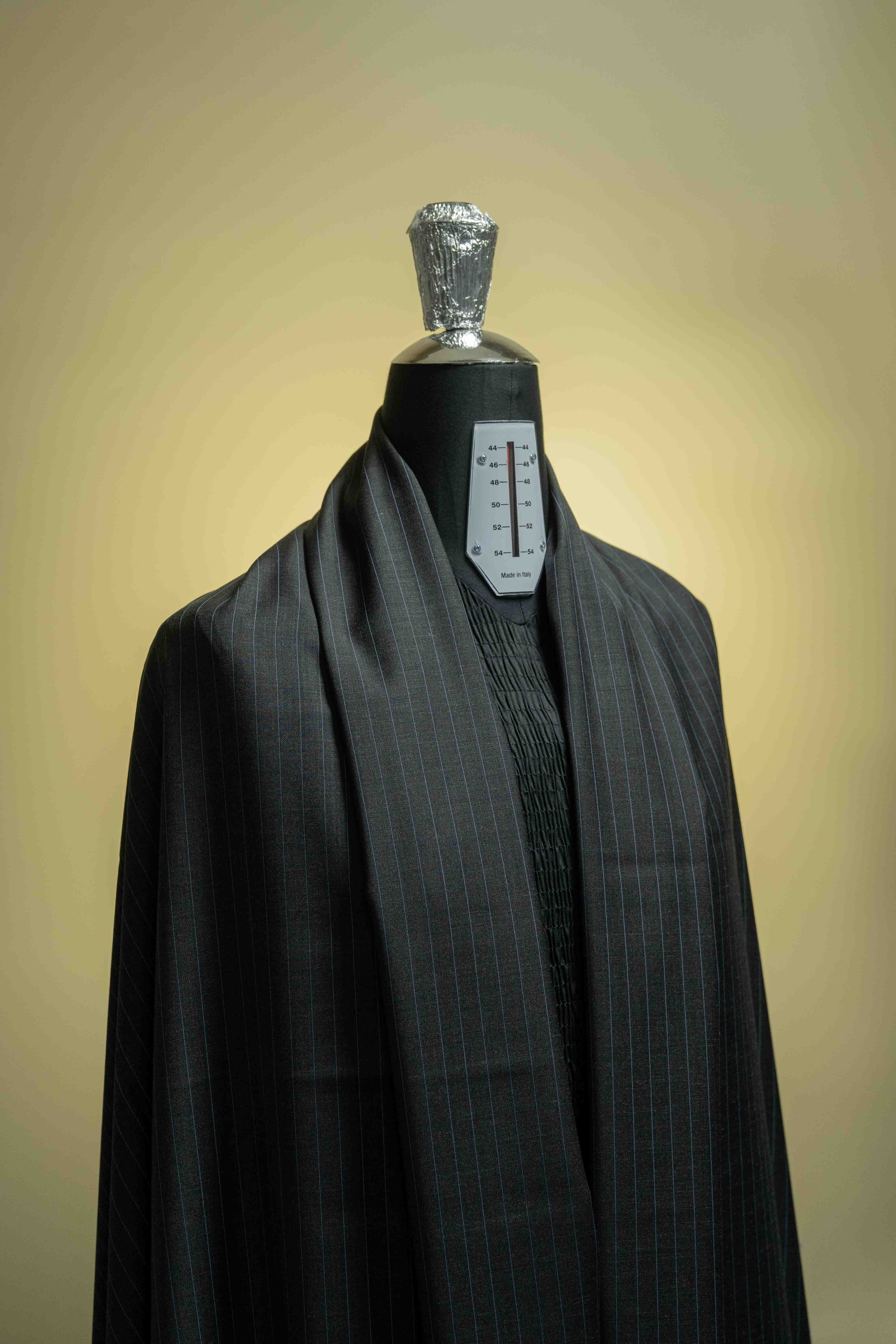 Charcoal blue stripe cashmere suiting on display, featuring a luxurious 150's fabric quality.