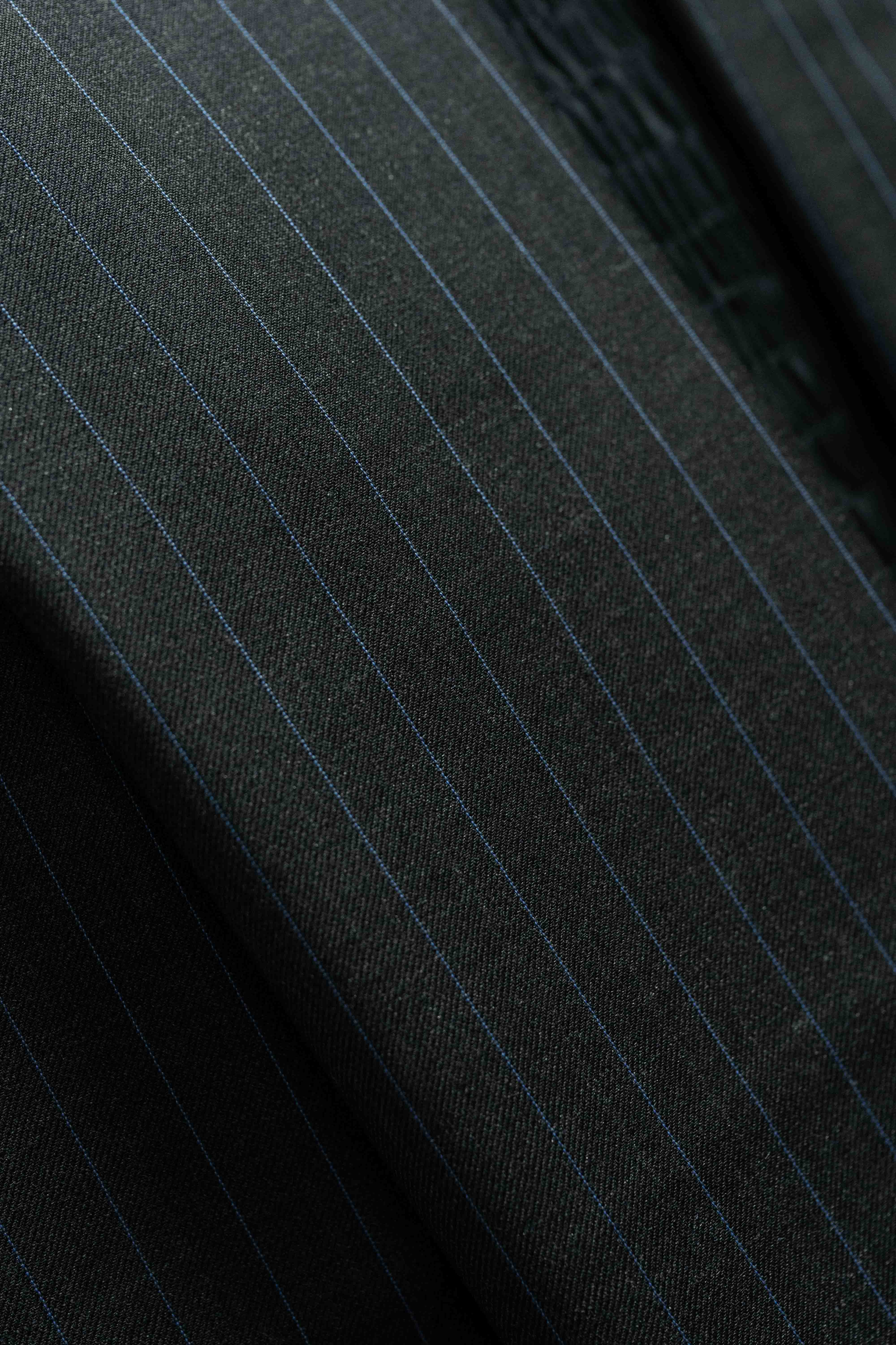 Close-up of Charcoal Blue Stripe fabric featuring cashmere for luxurious suiting options.