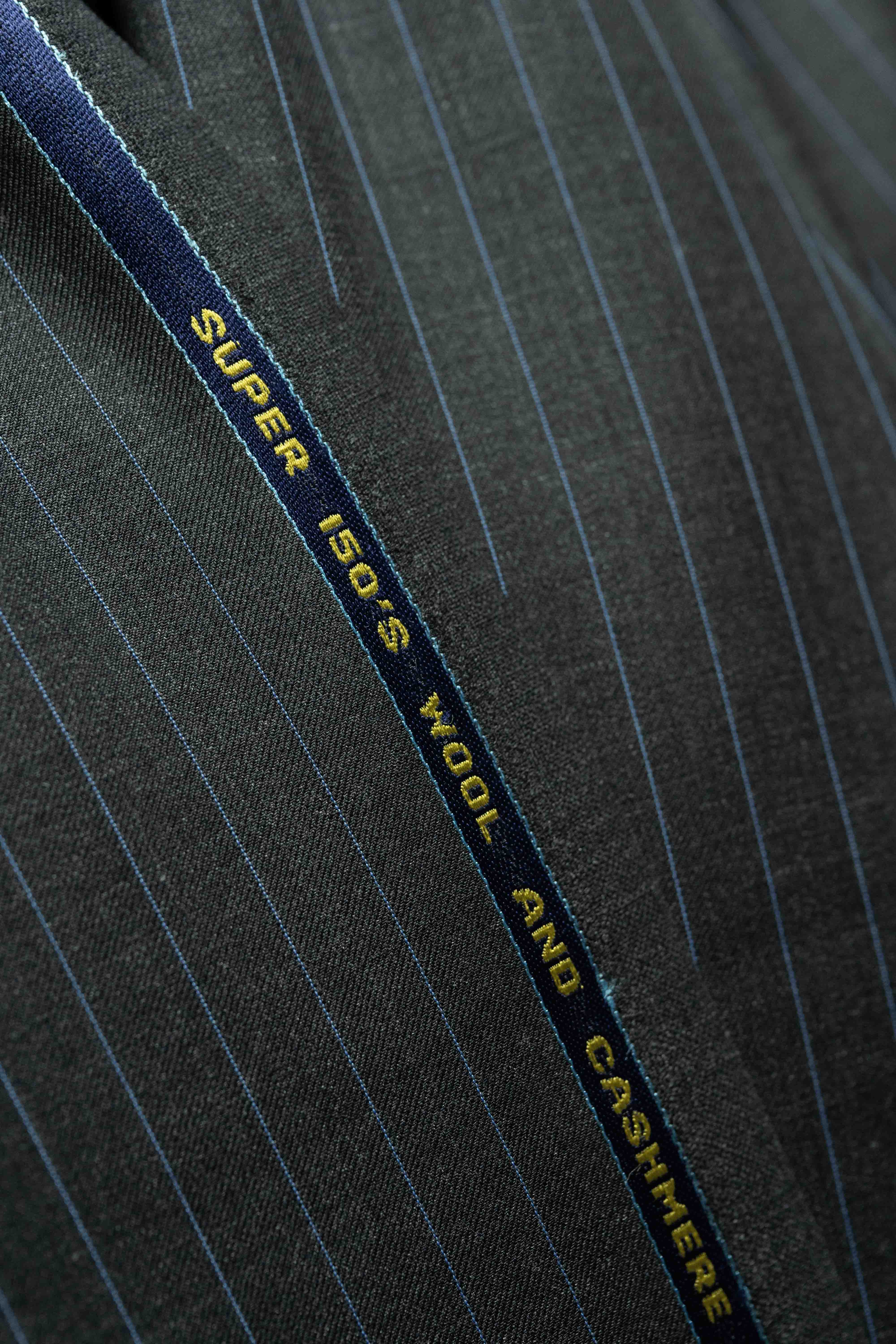 Charcoal blue stripe fabric showcasing Super 150's wool and cashmere for high-quality suiting.