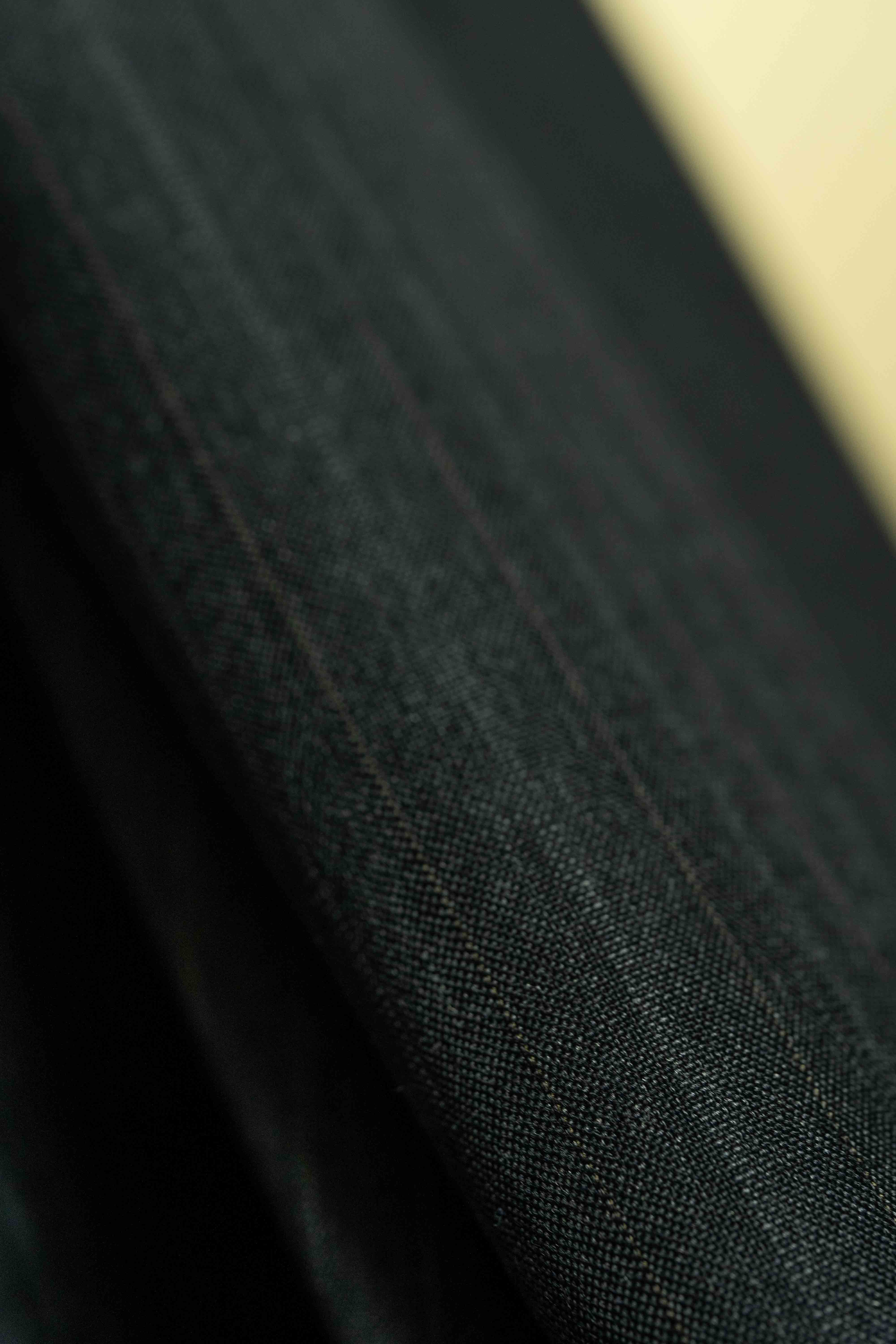 Lassitex Charcoal Stripe Merino Wool Suit Fabric (V23385) showcasing luxury suit fabric with fine detailing.