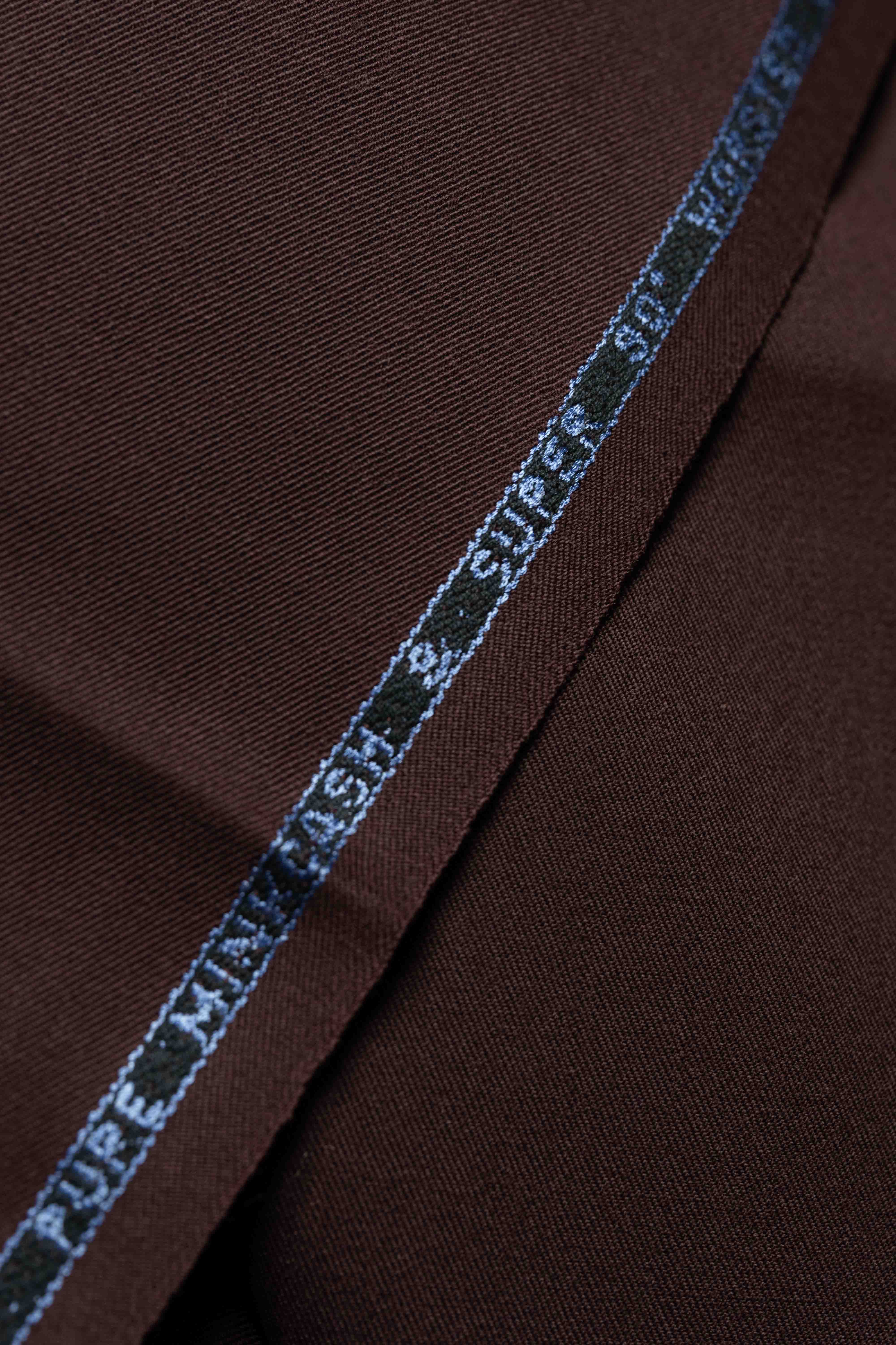 Close-up of red suit fabric with a label showcasing high-quality minkcash and gabardine material.