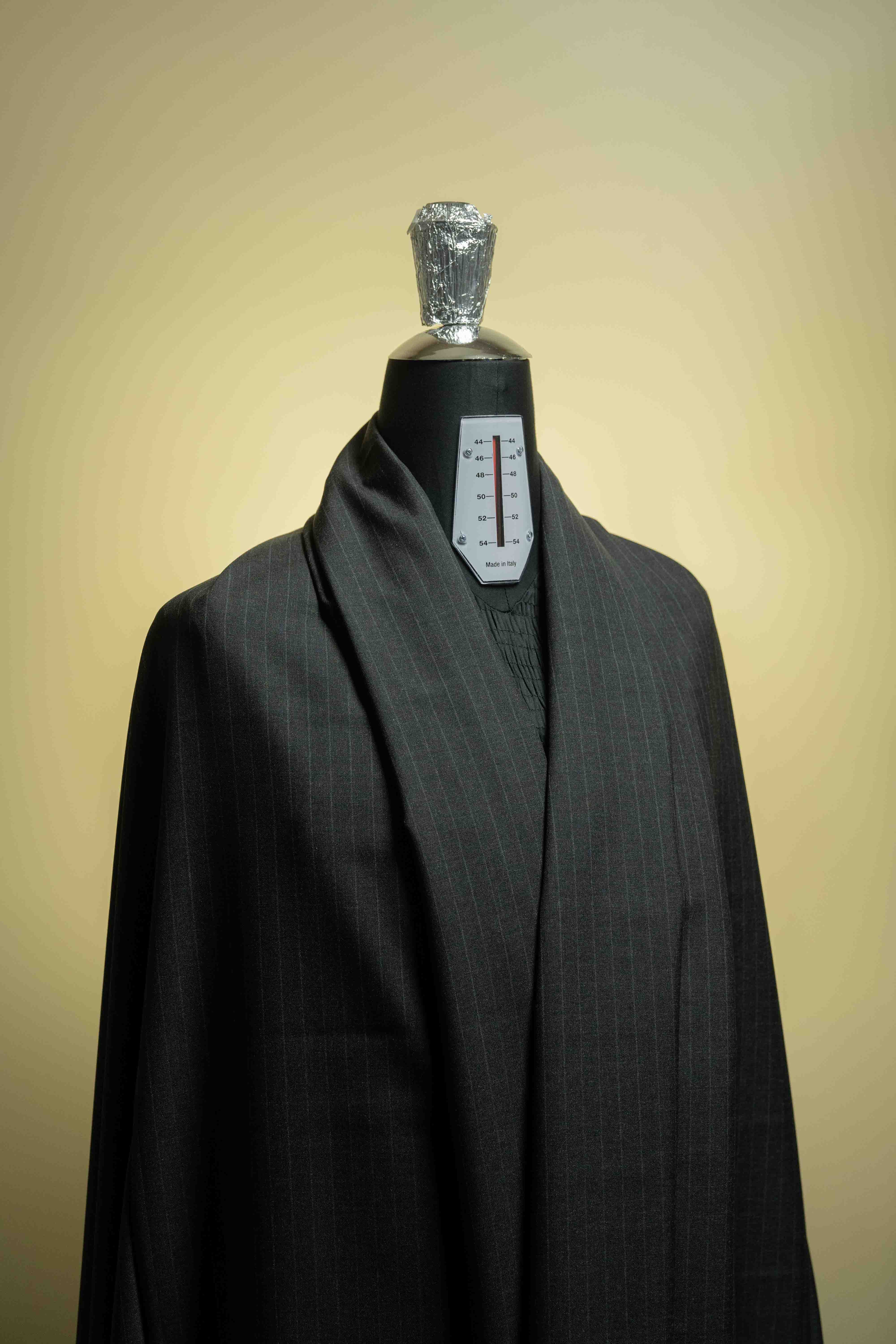 Hihg Twist Dark Grey 120's Wool Cashmere wool suit fabric displayed on a dress form.
