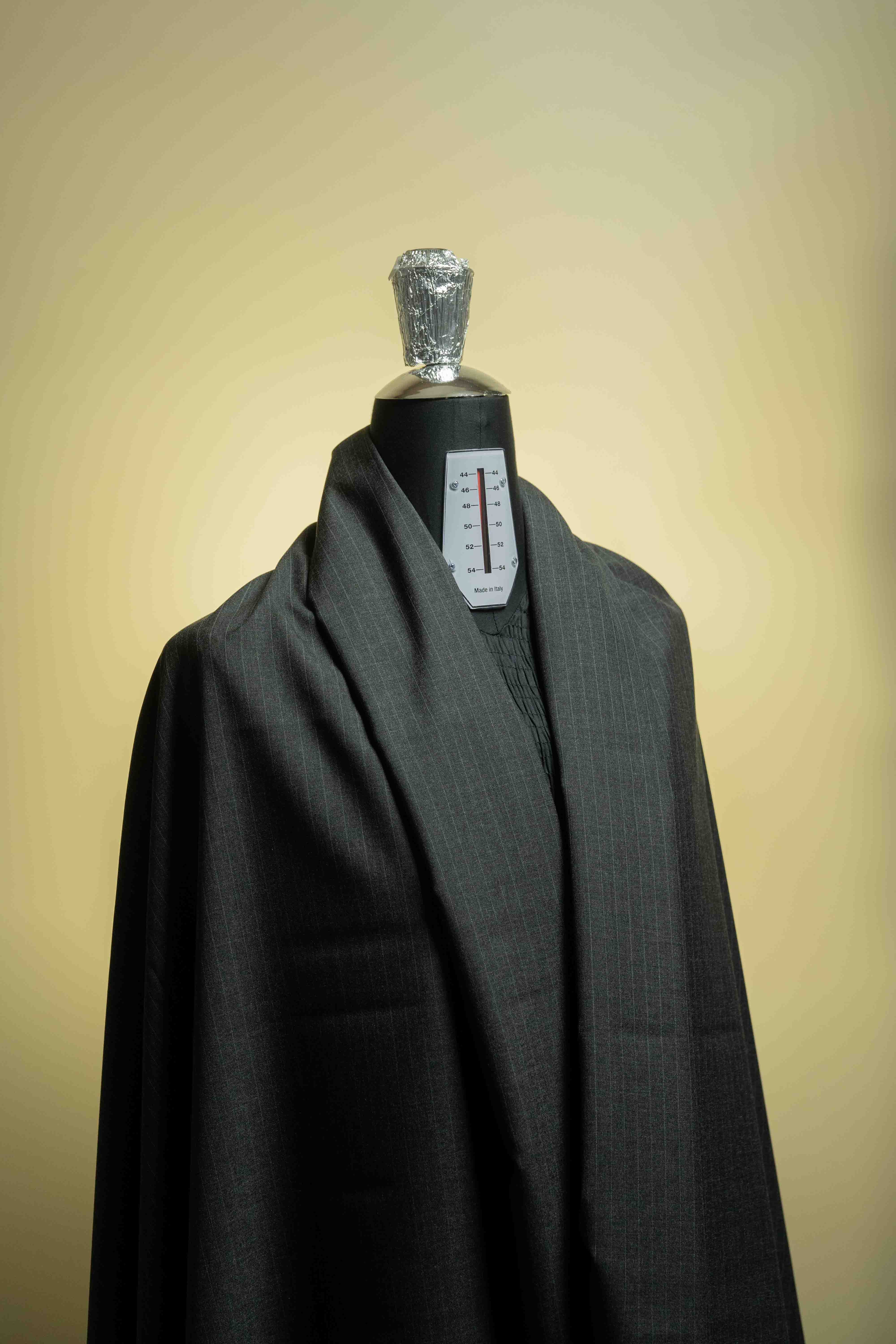 Mid Grey PinStripe 130's Wool Cashmere suit fabric draped on a mannequin, emphasizing the luxurious cashmere texture.