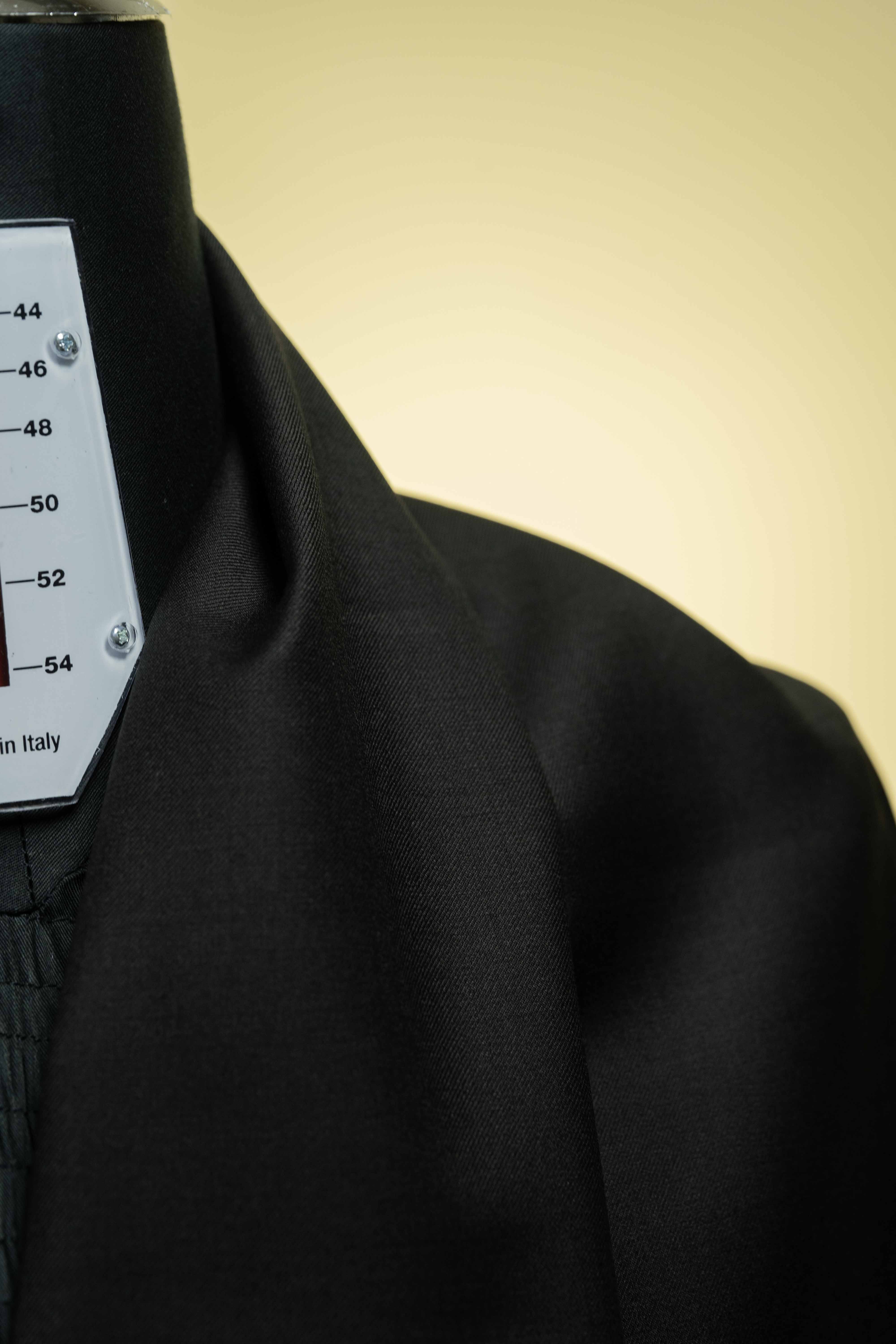 Close-up of a Black Merino Cashmere Wool with Silk Suit Jacket highlighting its smooth texture and sophisticated design.