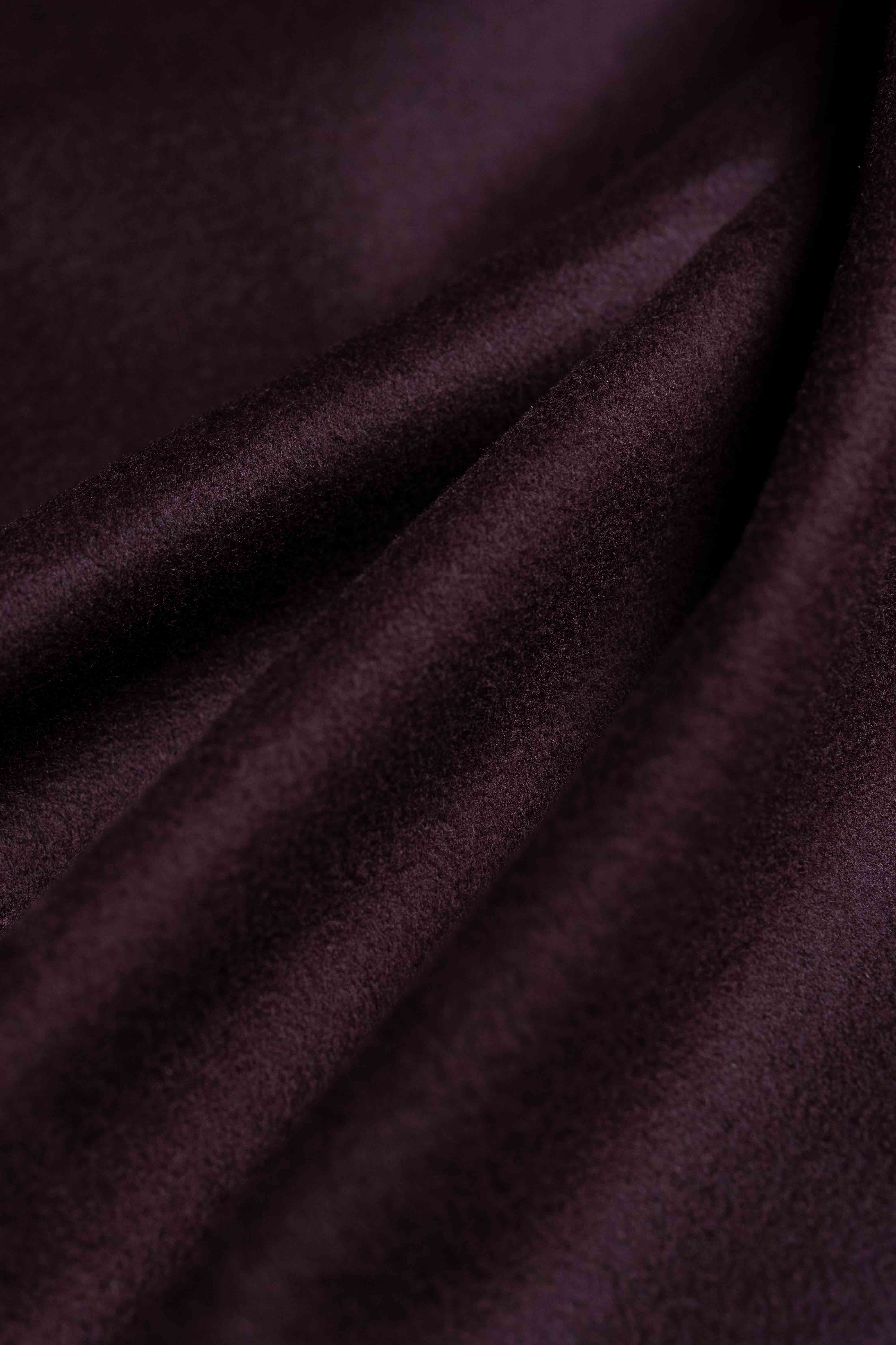 Close-up of dark purple fabric with folds
