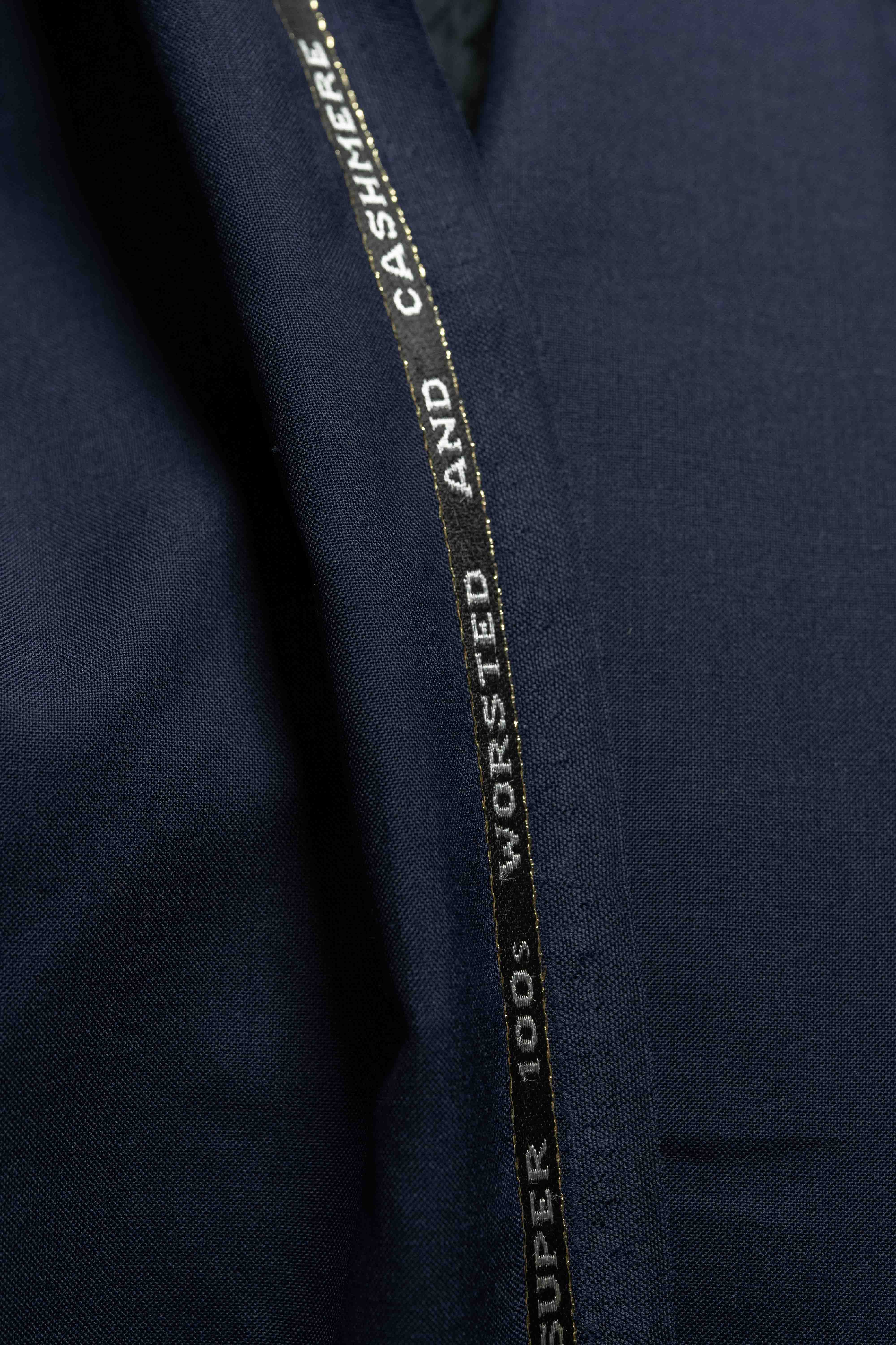 Close-up of Navy Suiting fabric made of Super 100's Wool & Cashmere, highlighting its luxurious texture.