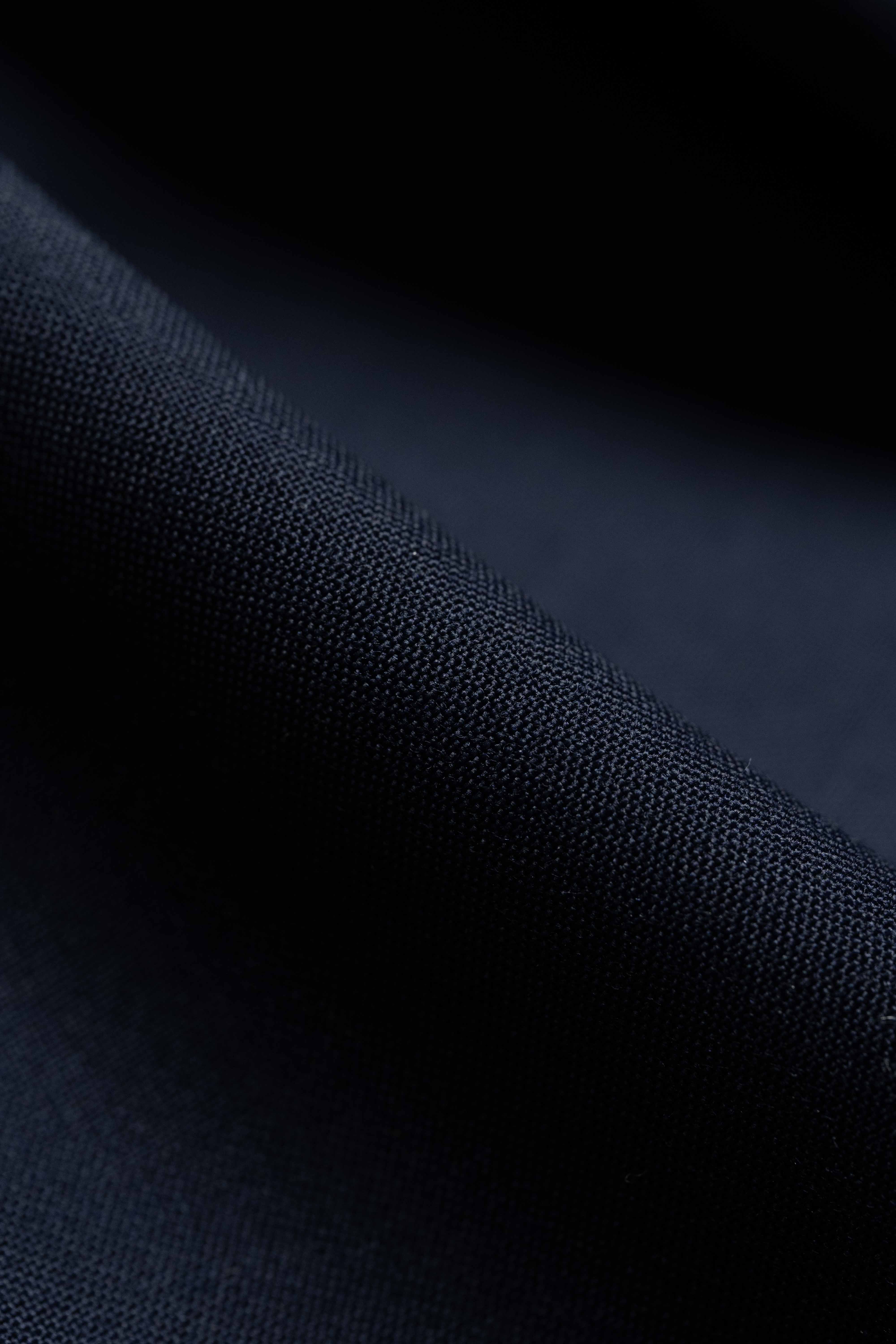 Navy Suiting in Super 100's Wool & Cashmere fabric texture close-up.