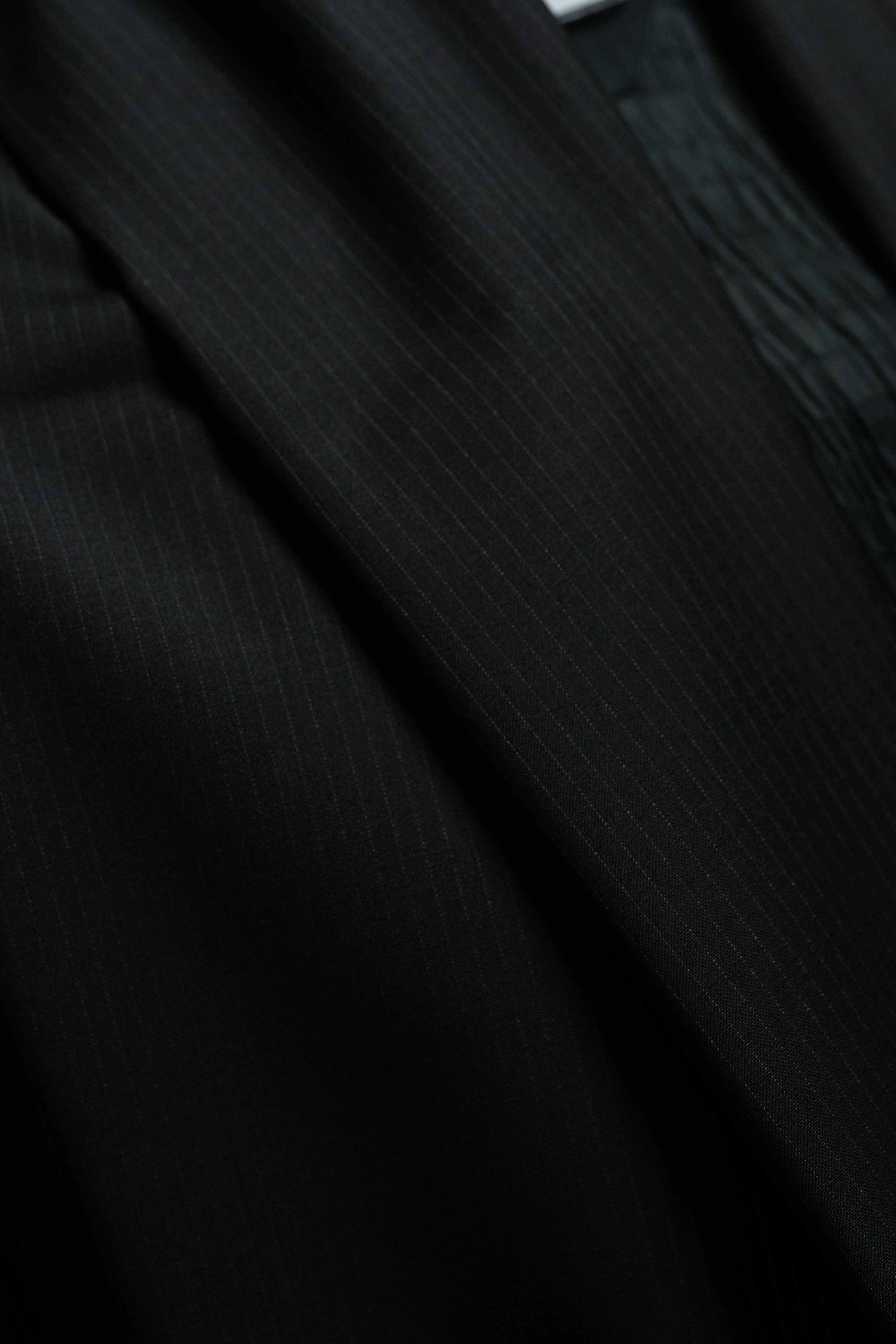 Reda Black Stripe Merino Wool Suit Fabric (V23334) close-up detailing of the premium wool texture.
