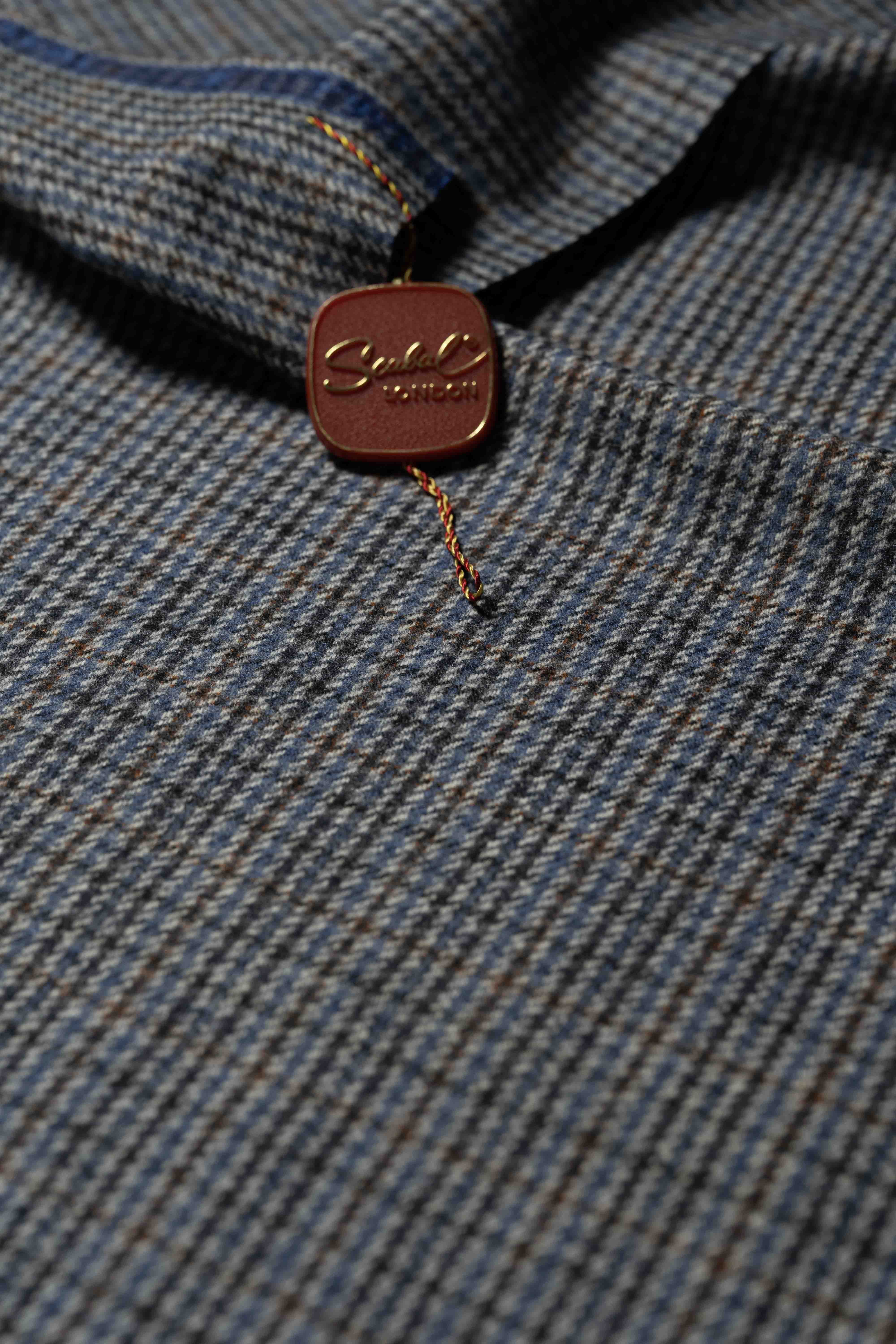 Scabal Check Pure Lambswool Suit Fabric (SA-1110) featuring a close-up of the fabric pattern and branded tag.