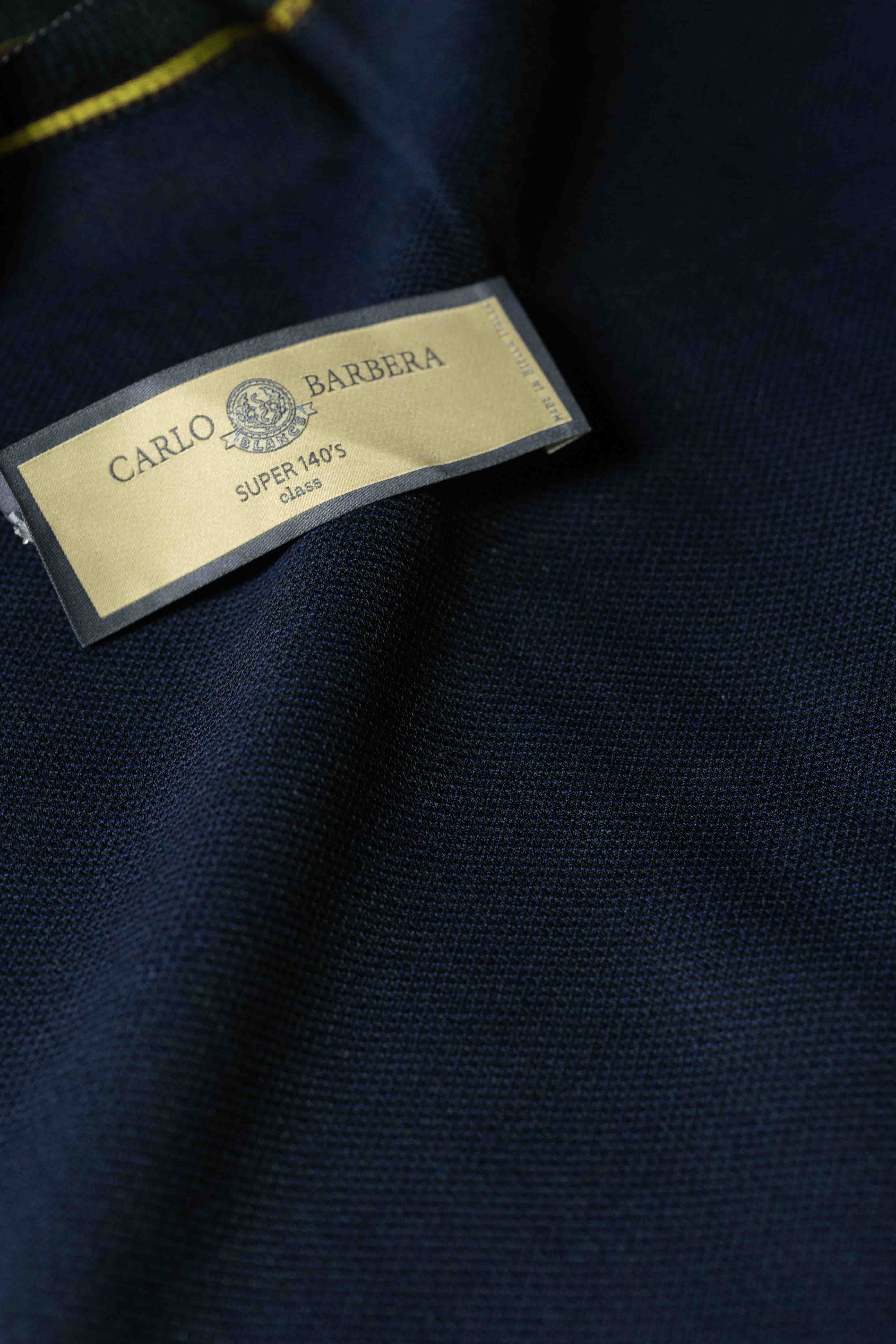Carlo Barbera Navy Super 140's Suit Fabric showcasing the label on rich navy material.