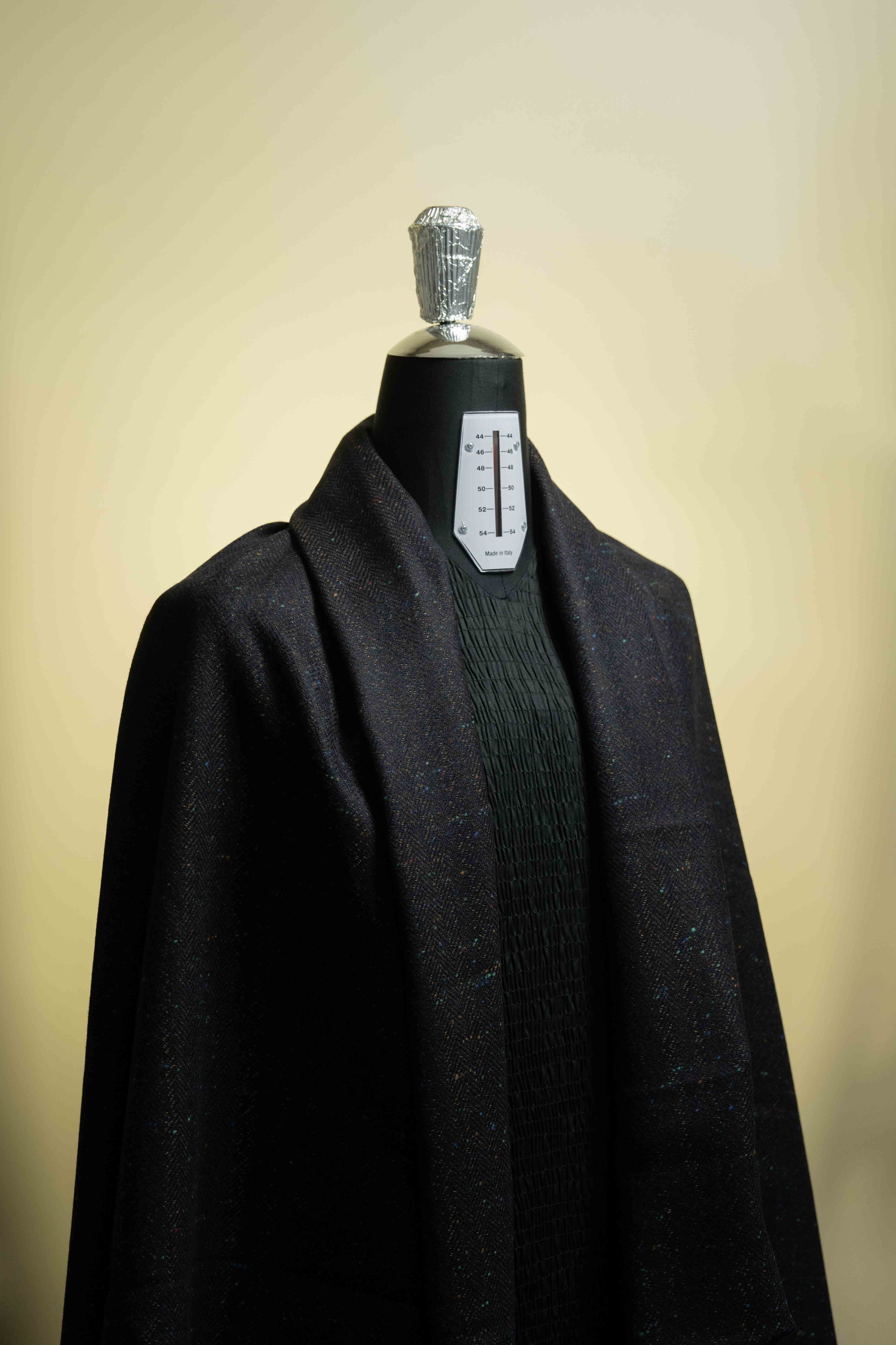Fancy wool jacket fabric displayed on a mannequin for men suit design inspiration and tailoring.