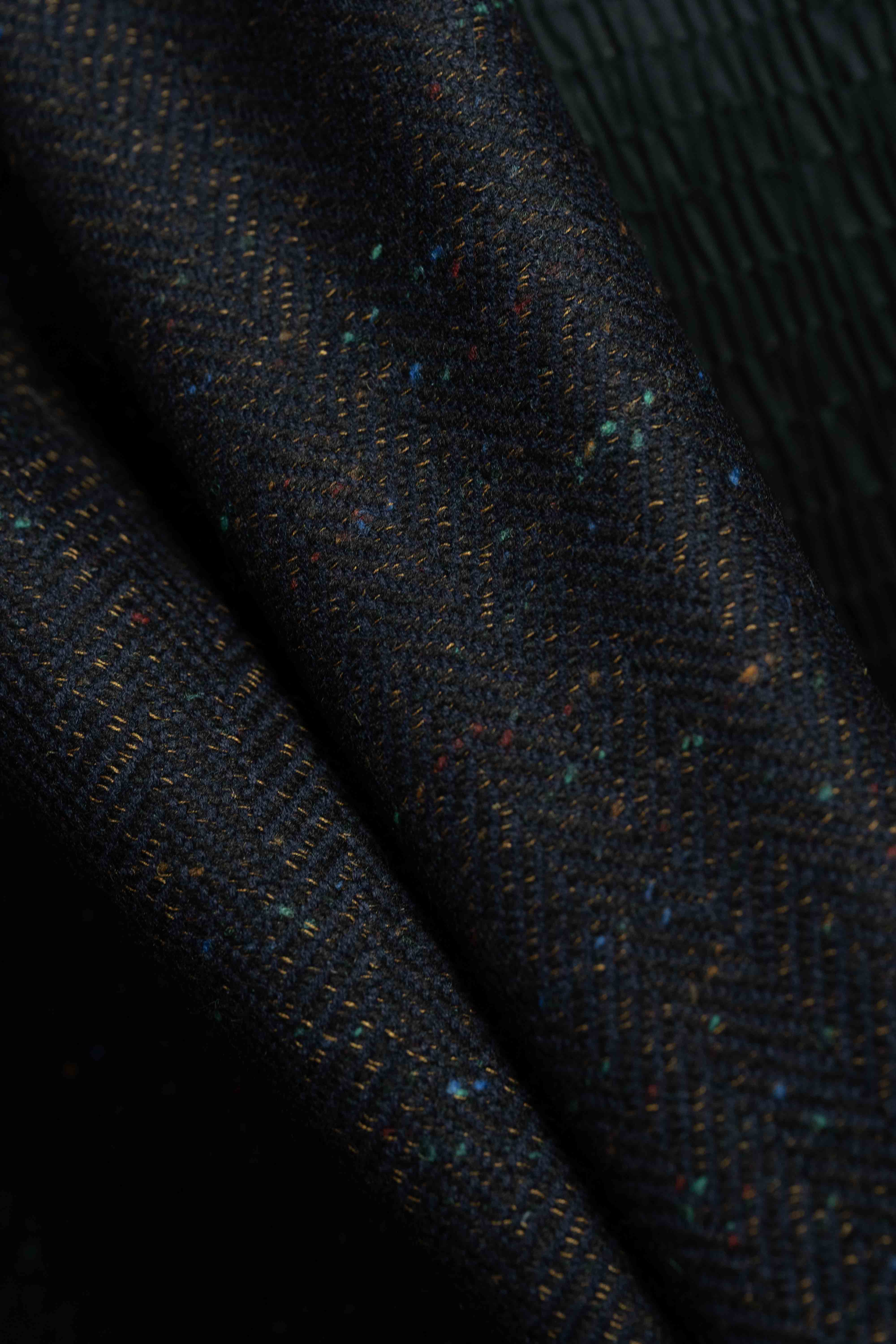 Fancy wool jacket fabric, ideal for creating a stylish Men Suit, featuring a unique textured pattern.