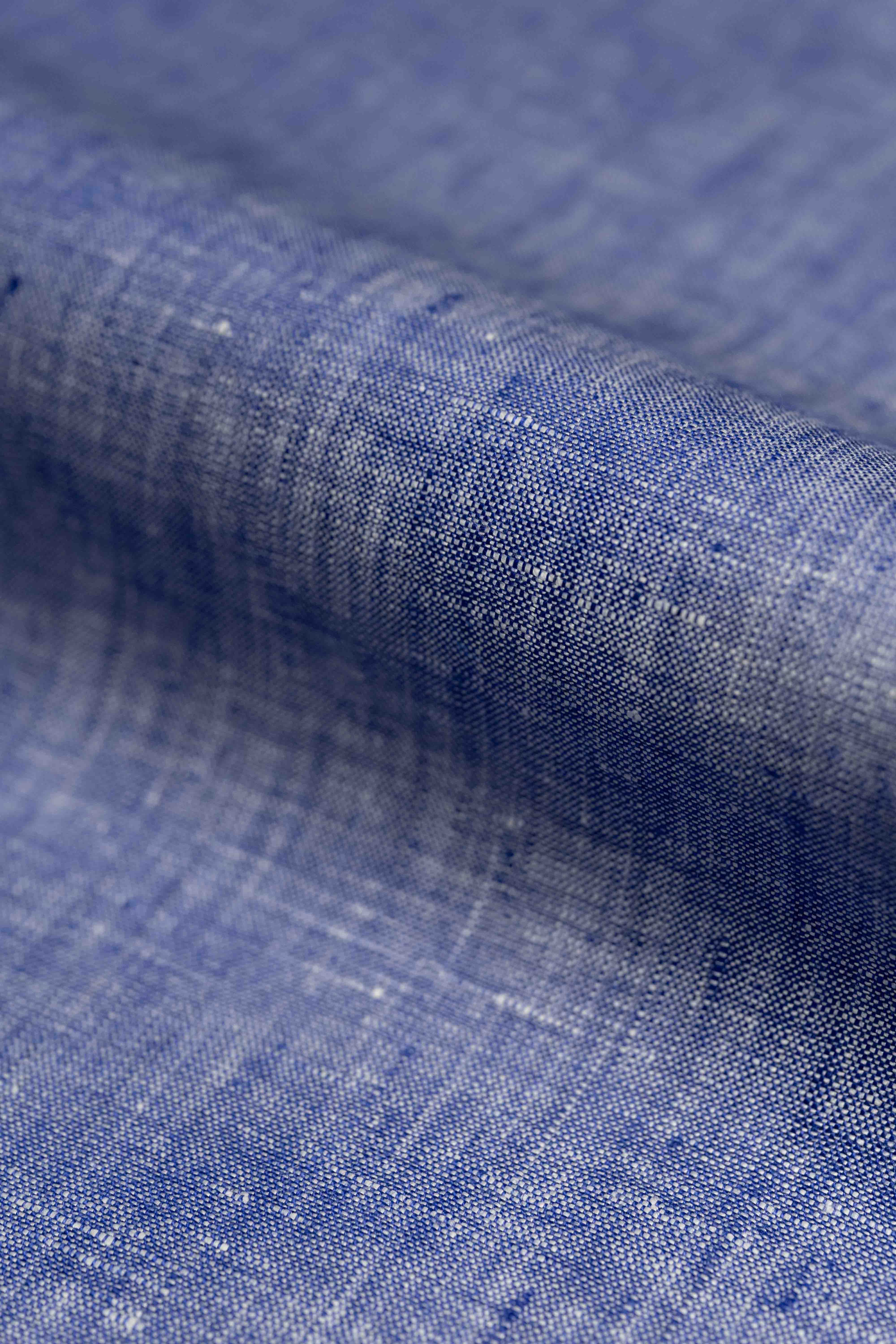 Close-up of blue fabric with a textured pattern