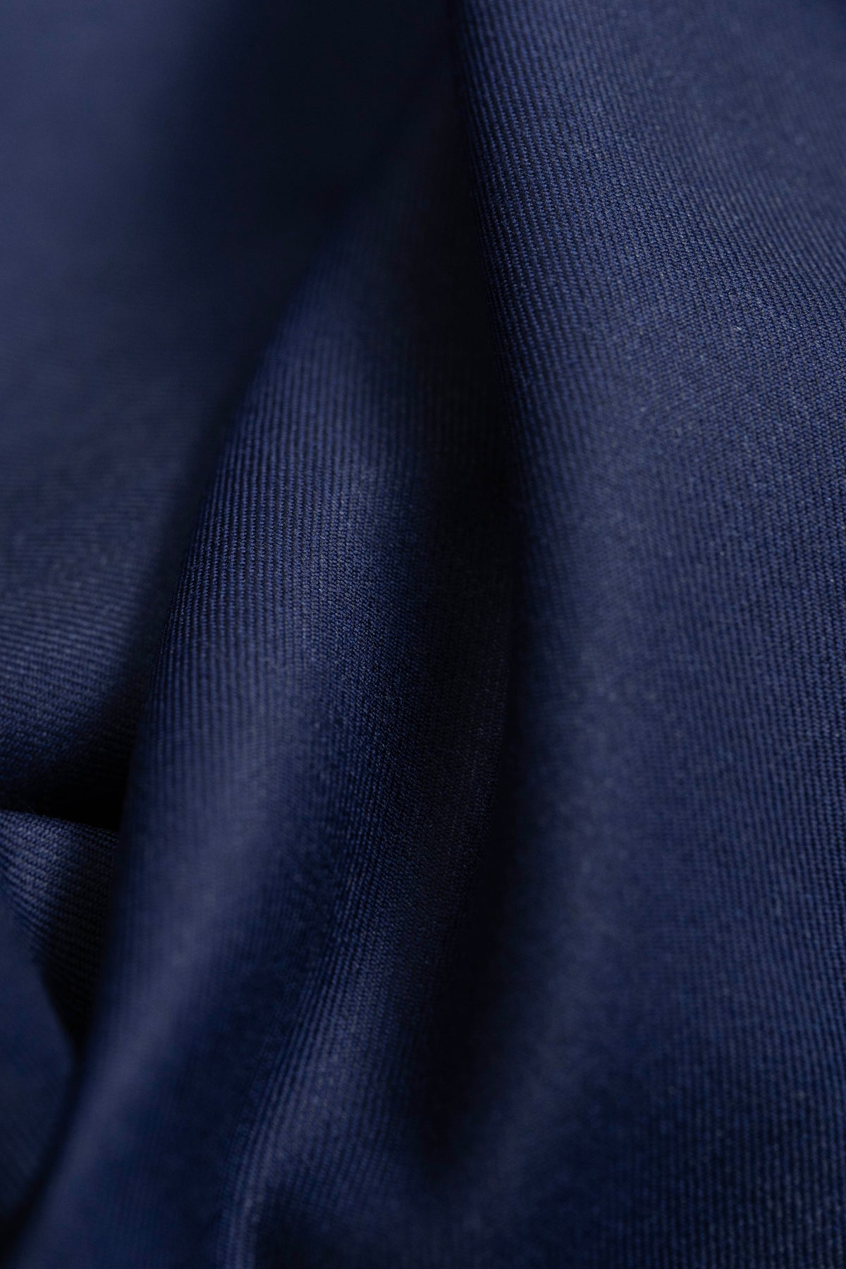 Giovanni Tonella Blue Super 120's Wool Suiting Fabric showcasing the rich texture and deep blue color.