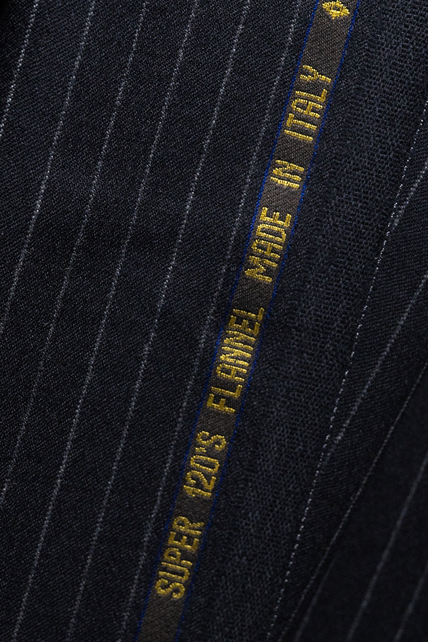 VBC Lightweight Black Stripe Flannel Suiting with Super 120s label, showcasing fine Italian craftsmanship.