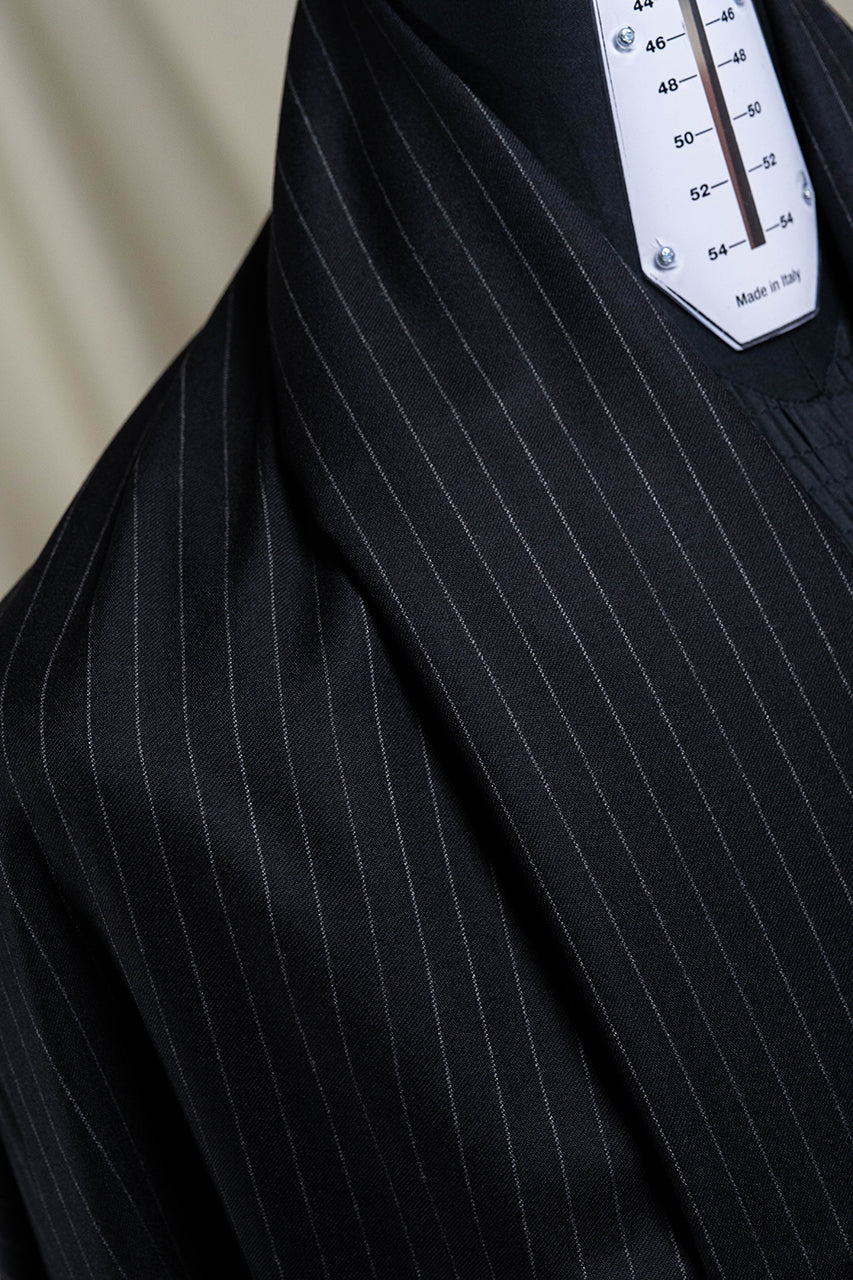 VBC Lightweight black stripe flannel suiting fabric displayed on a mannequin with measurement gauge