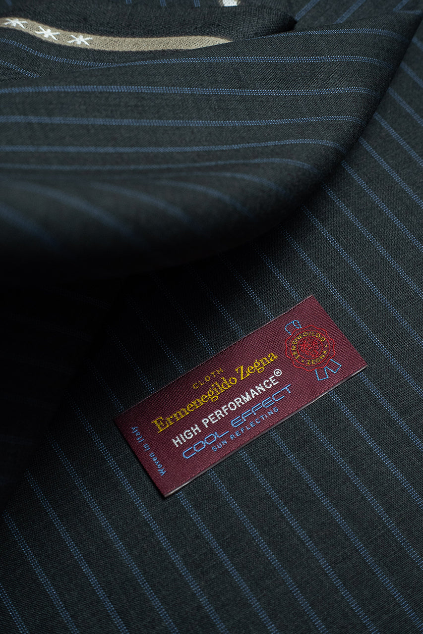 Zegna fabric featuring charcoal stripe design with High Performance label, showcasing the luxury of superfine Australian wool.
